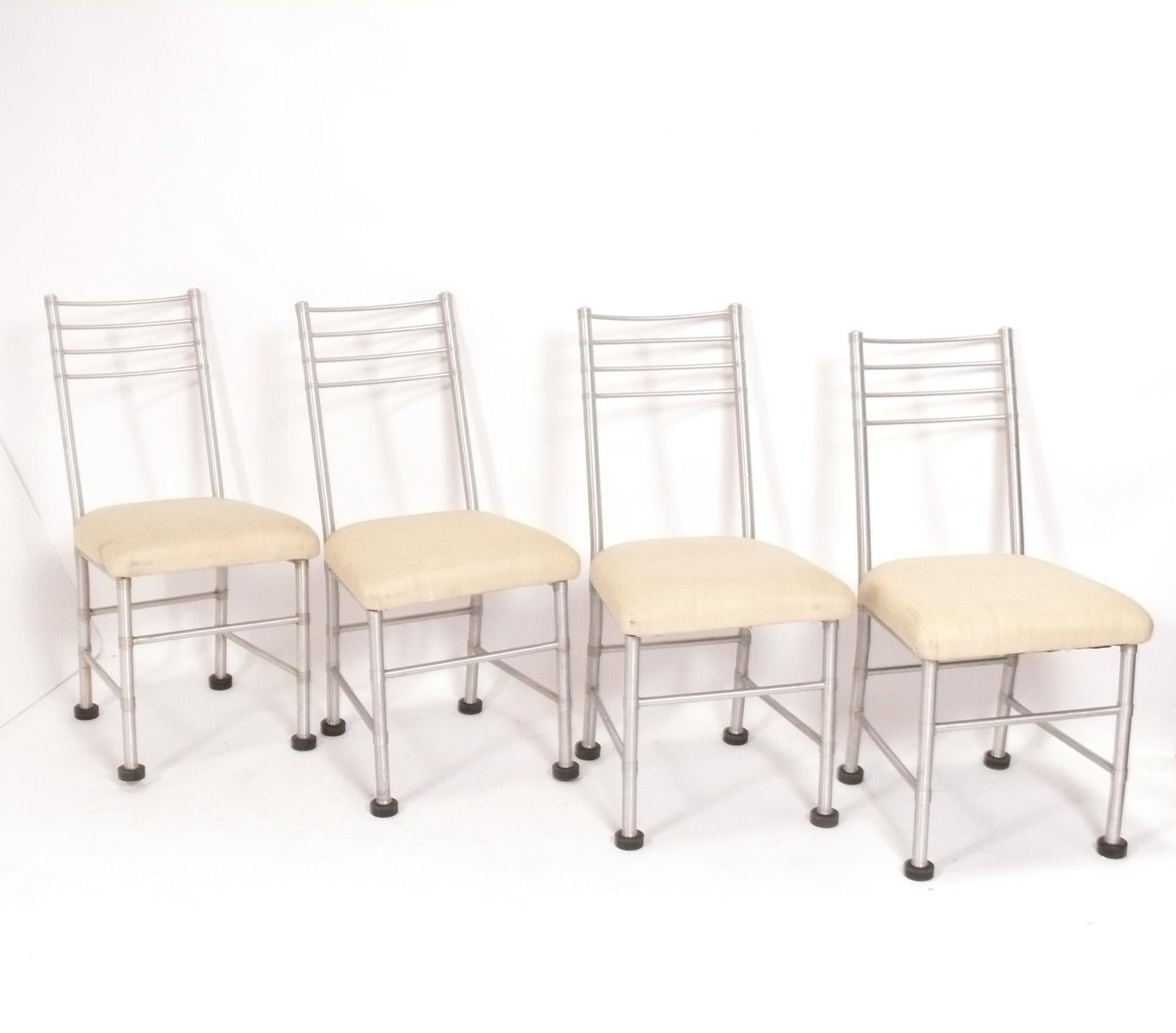 Four Art Deco Aluminum Dining Chairs, designed by Warren McArthur, American, circa 1930s. Signed with Warren McArthur label. These chairs are currently being reupholstered and can be completed in your fabric. Simply send us three yards of your