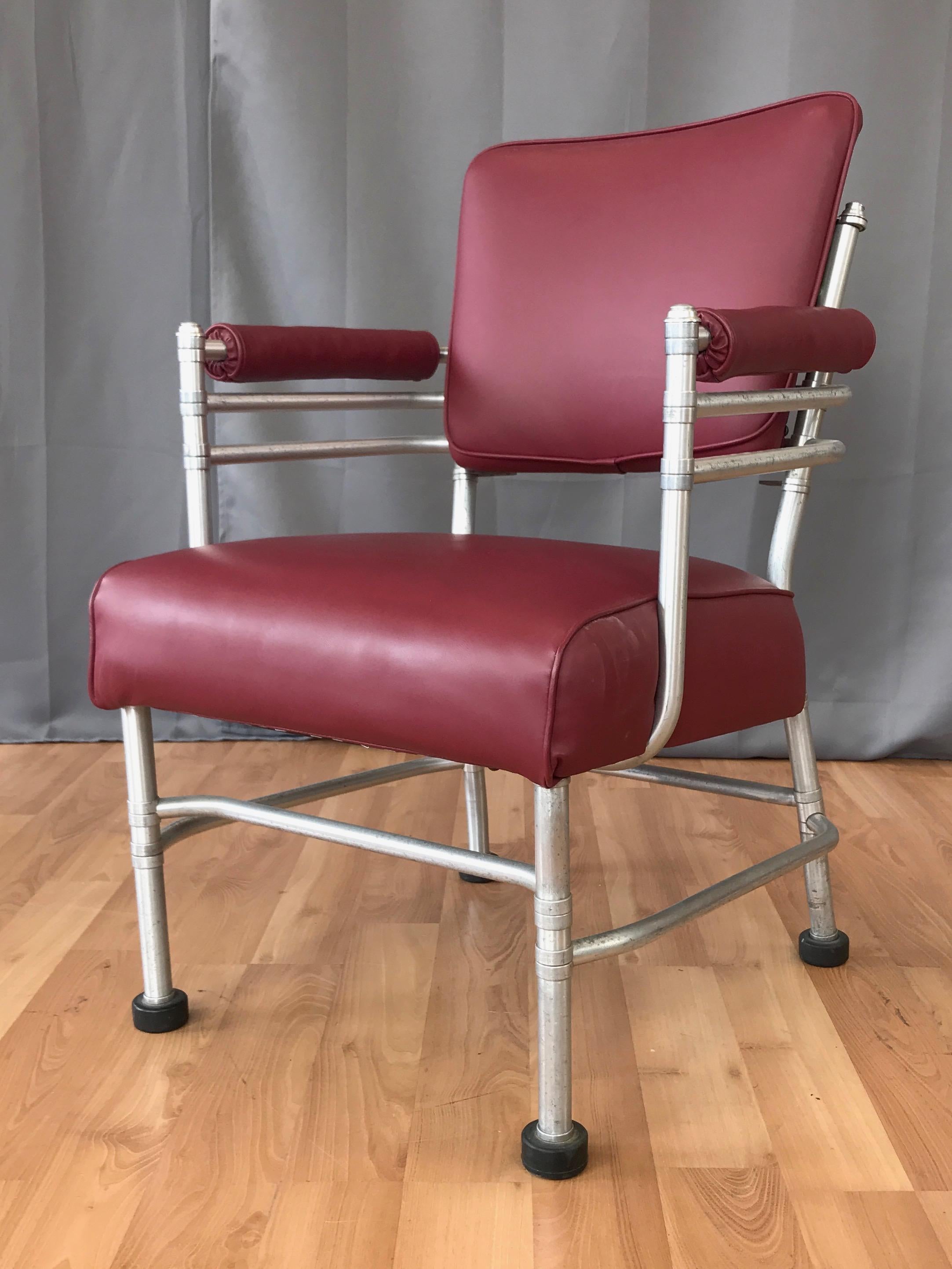 A rare mid-1930s Art Deco aluminum armchair by important American designer Warren McArthur.

Displays McArthur’s signature Streamline Moderne-meets-Machine Age aesthetic, with a painstakingly crafted multi-piece anodized aluminum tubular frame over