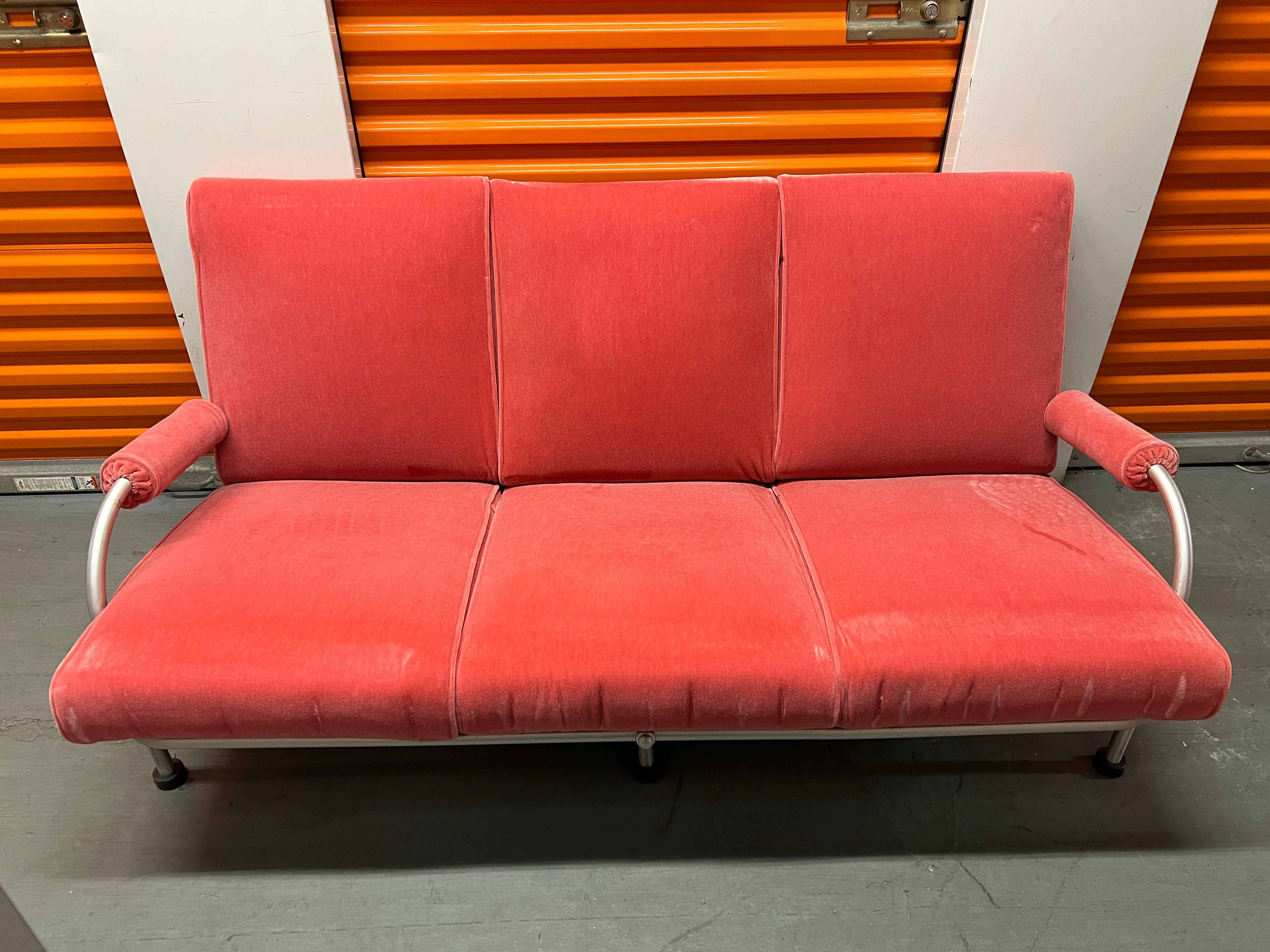 American Art Deco Biltmore sofa by Warren McArthur in aluminum with pink mohair cushions. This design was created for the famed Arizona Biltmore Hotel. While most metal furniture designers of the day worked with chromed steel, McArthur favored