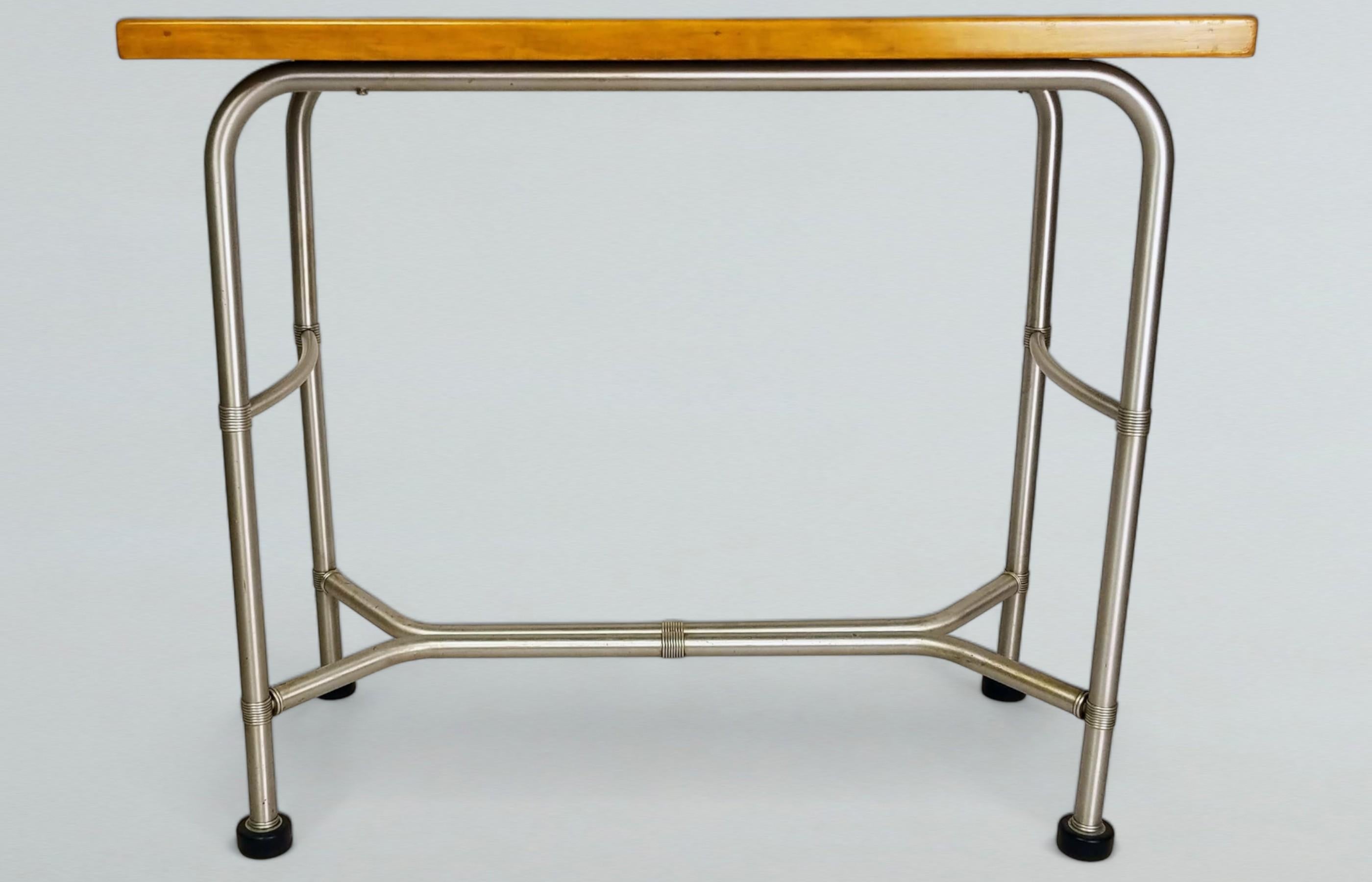 Unusual Warren McArthur console or perhaps a work table from a department store or beauty salon cosmetic cubicle.
The sky blue Cafolite top was produced for the Warren McArthur Corporation in Muskegon, Michigan and was similar to Formica.
The