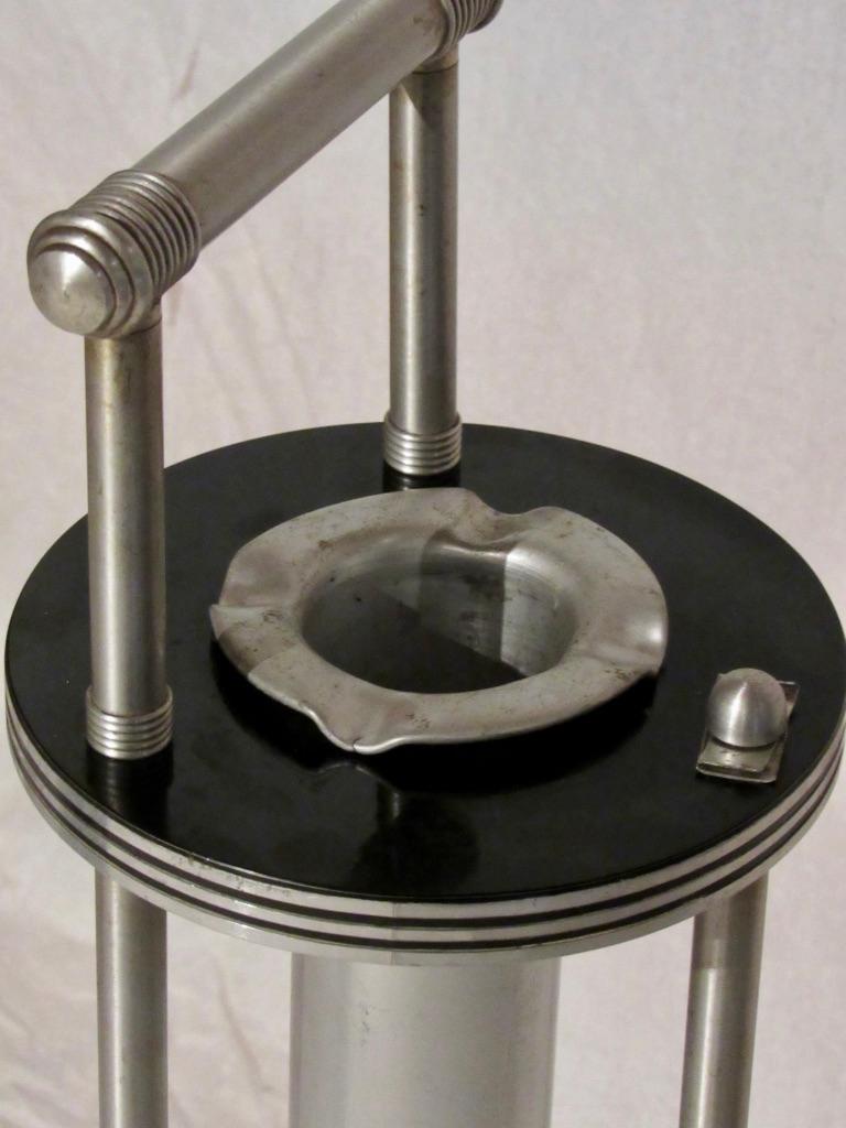 A Warren McArthur smoking stand from the early mid-1930s manufactured in Rome, New York.
The ash holder has a wooden inset which is characteristic of very early production later ash holders are completely fabricated from aluminum. Cool detail.
The