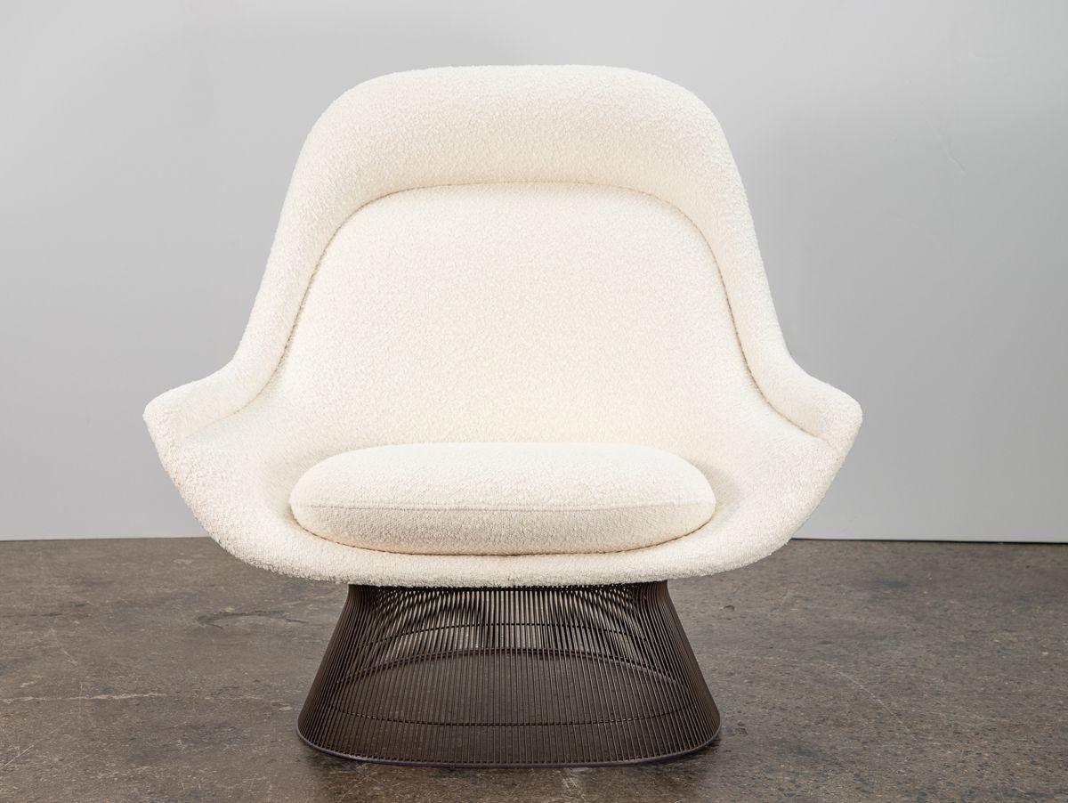 Luxurious Model 1705 Easy Chair and Ottoman in the sought after bronze finish, designed by Warren Platner for Knoll. Steel wire rods are bent and welded to form a graceful, sculptural silhouette. A generously sized lounge chair, the comfortable seat
