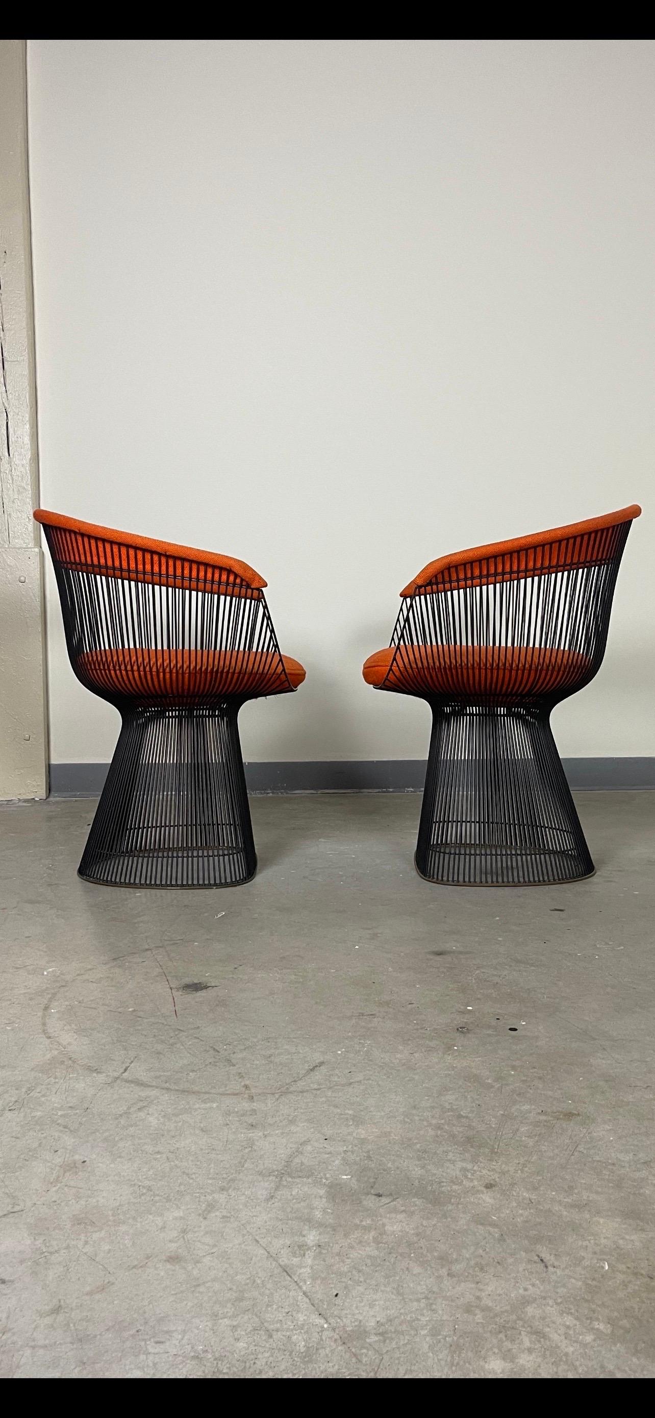 Bronze framed dining chairs designed by Warren Platner for Knoll with original wool upholstery. Patina on bronze frames is age appropriate. Original wool upholstery, recommended to be replaced as well as the foam. Original Knoll manufacturers tags