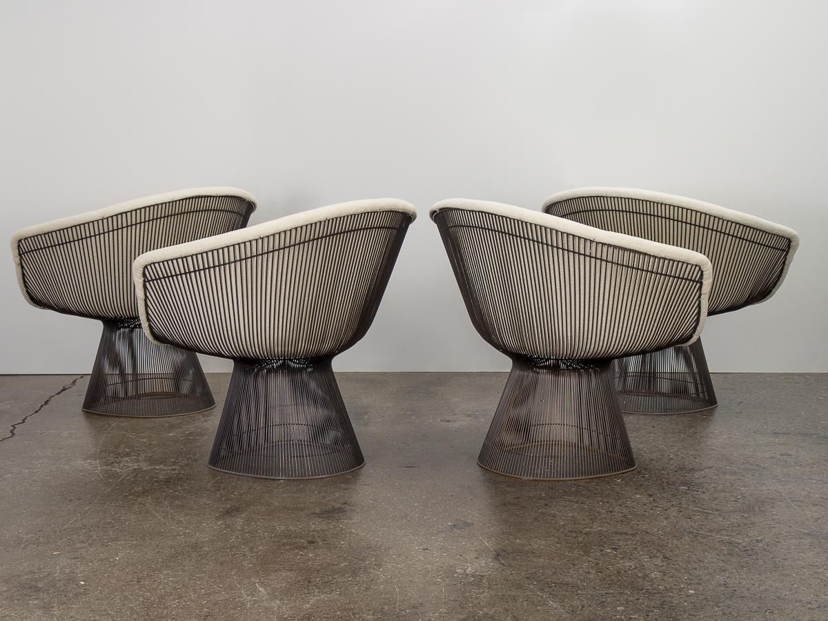 An early set of four model 1715 lounge chairs with bronze frame, designed by Warren Platner for his namesake collection for Knoll. Timeless modern design with scarce bronze-plate finish to the sculptural metal frame. Steel wire rods are bent and