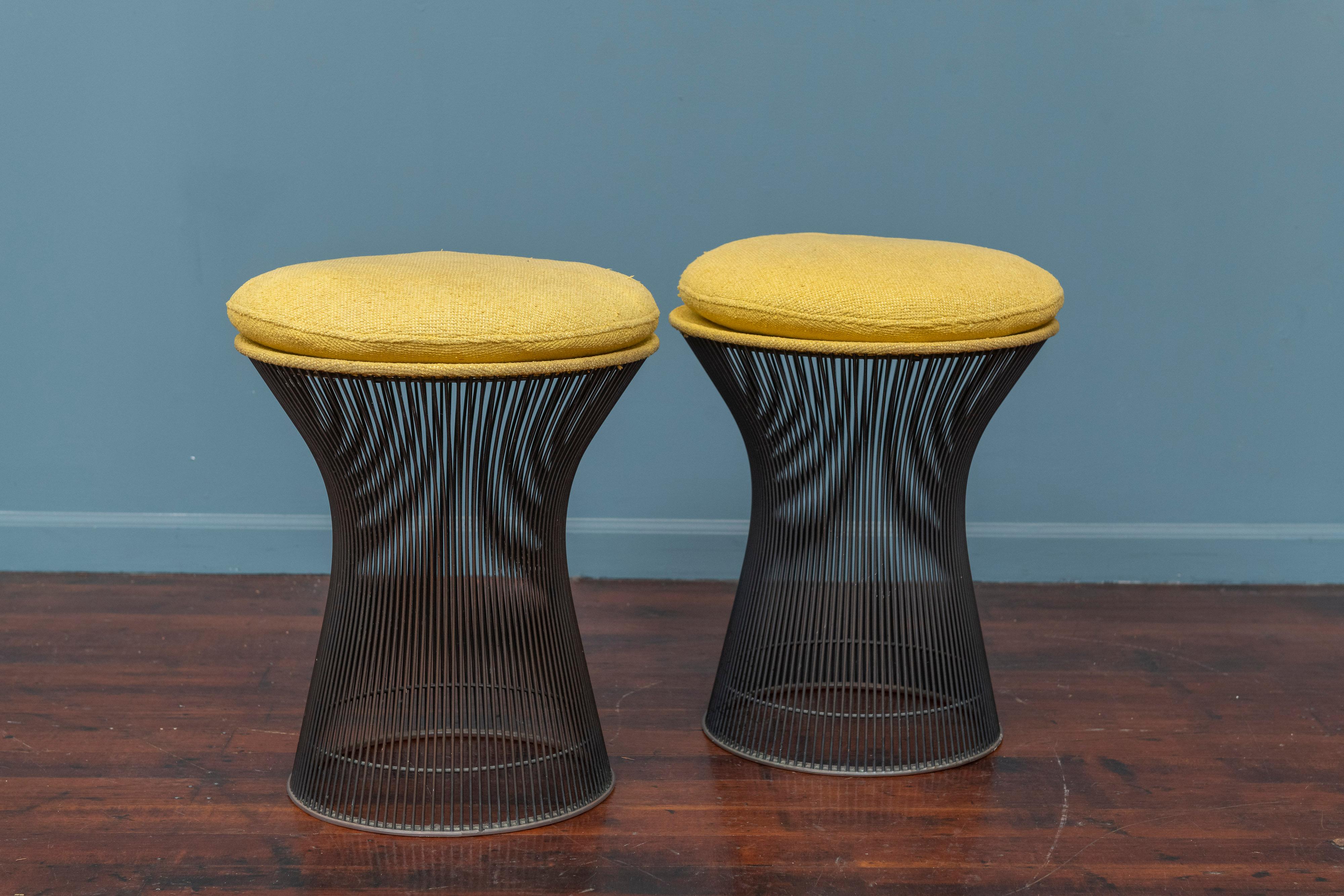 Warren Platner design stools for Knoll Furniture Co. Rare pair of bronze finish stools with original upholstery that is usable as-is but would benefit from new upholstery. Iconic design that has stood the test of time as contemporary furniture that