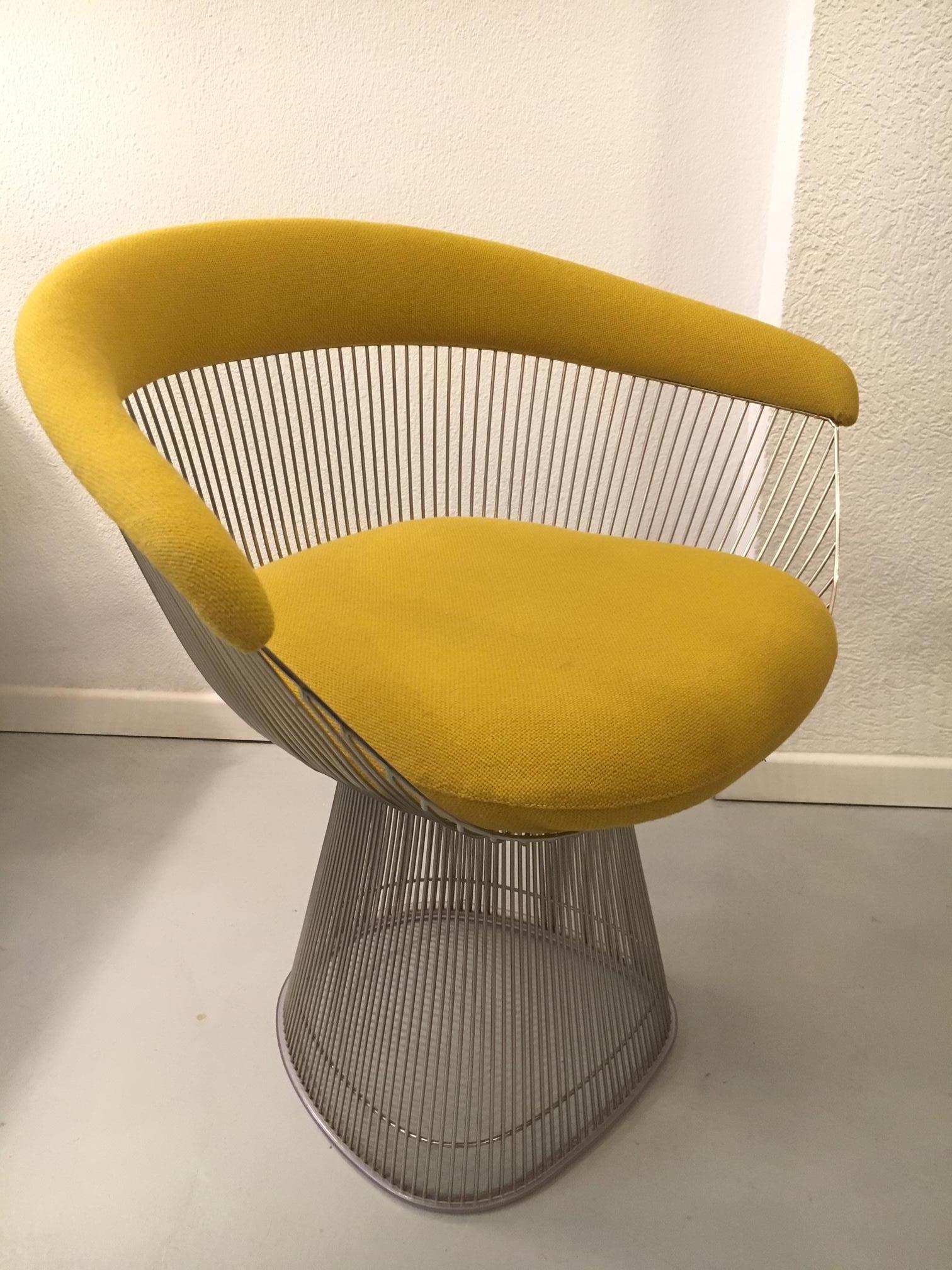 One chrome and yellow fabric chair by Warren Platner, produced by Knoll, circa, 1970s.
In 1966, the Platner Collection captured the “decorative, gentle, graceful” shapes that were beginning to infiltrate the modern vocabulary. 
The Arm Chair, which