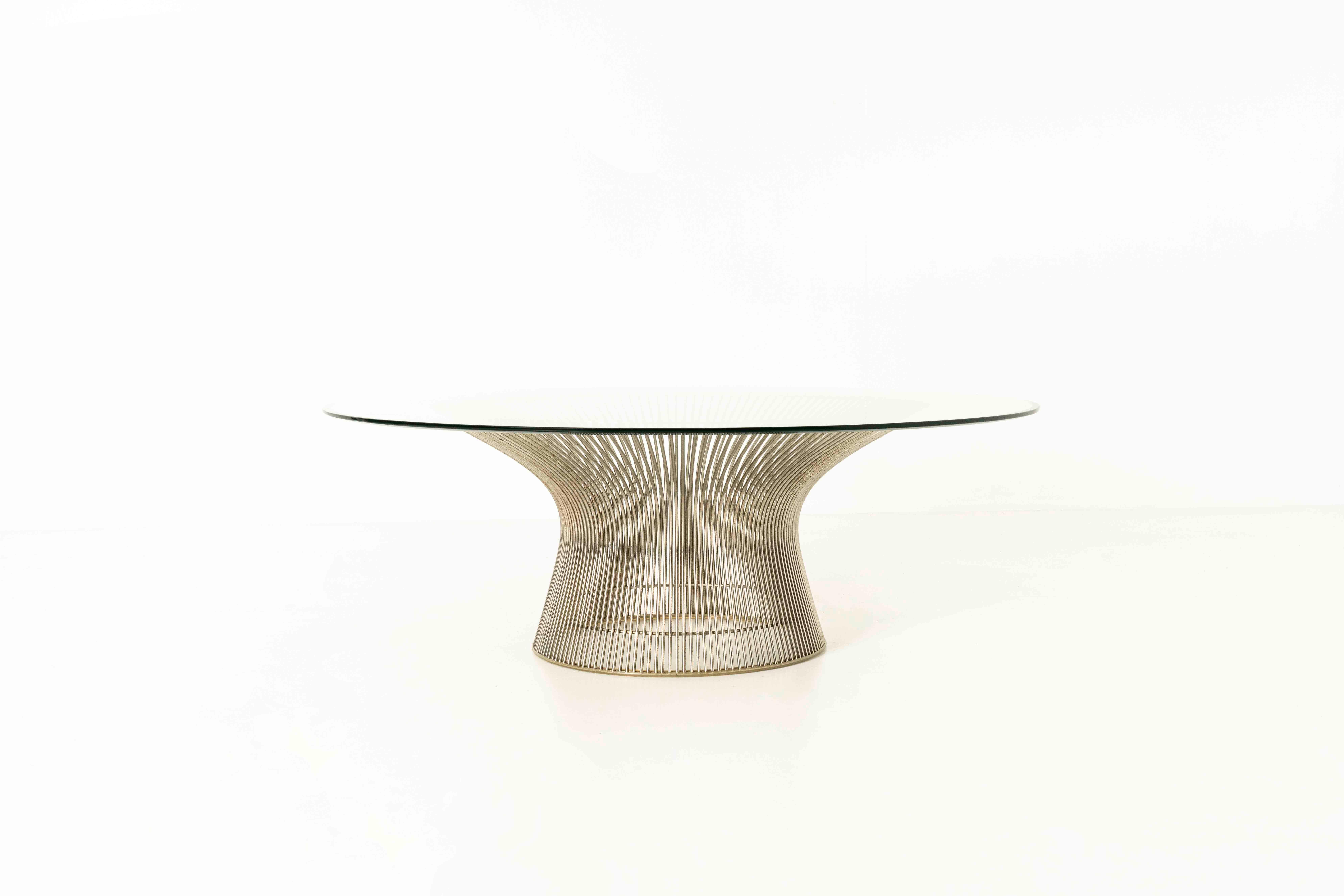 This wireframe and glass coffee table by Warren Platner has become one of the iconic designs from the 20th century. It is created by welding hundreds of curved steel rods to a circular frame, simultaneously serving as structure and ornament. The