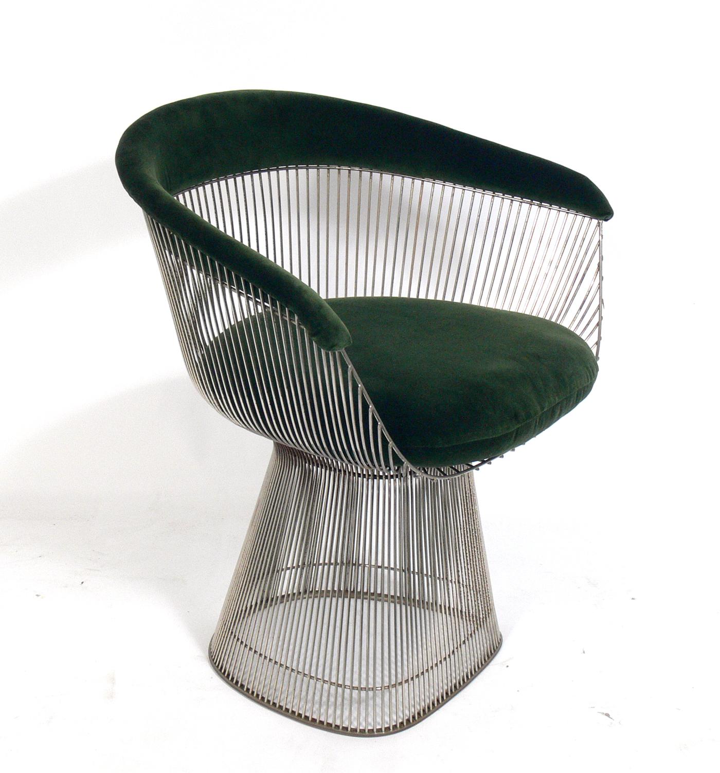 Set of six sculptural chrome dining chairs, designed by Warren Platner for Knoll, American, circa 1960s. They have been reupholstered in a plush deep green velvet. This listing is for the set of six dining chairs only.