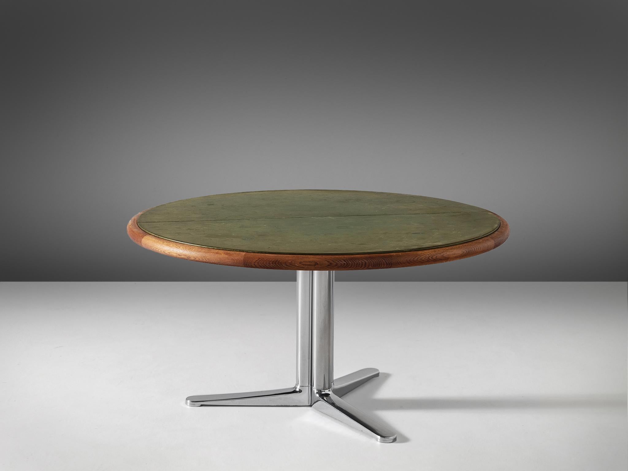 Warren Platner for Knoll International, dining table, in oak, leather and steel, United States, 1960s.

Round dining table by Warren Platner. This table has a top of green leather. The leather shows a beautiful patina, yet there are some traces of
