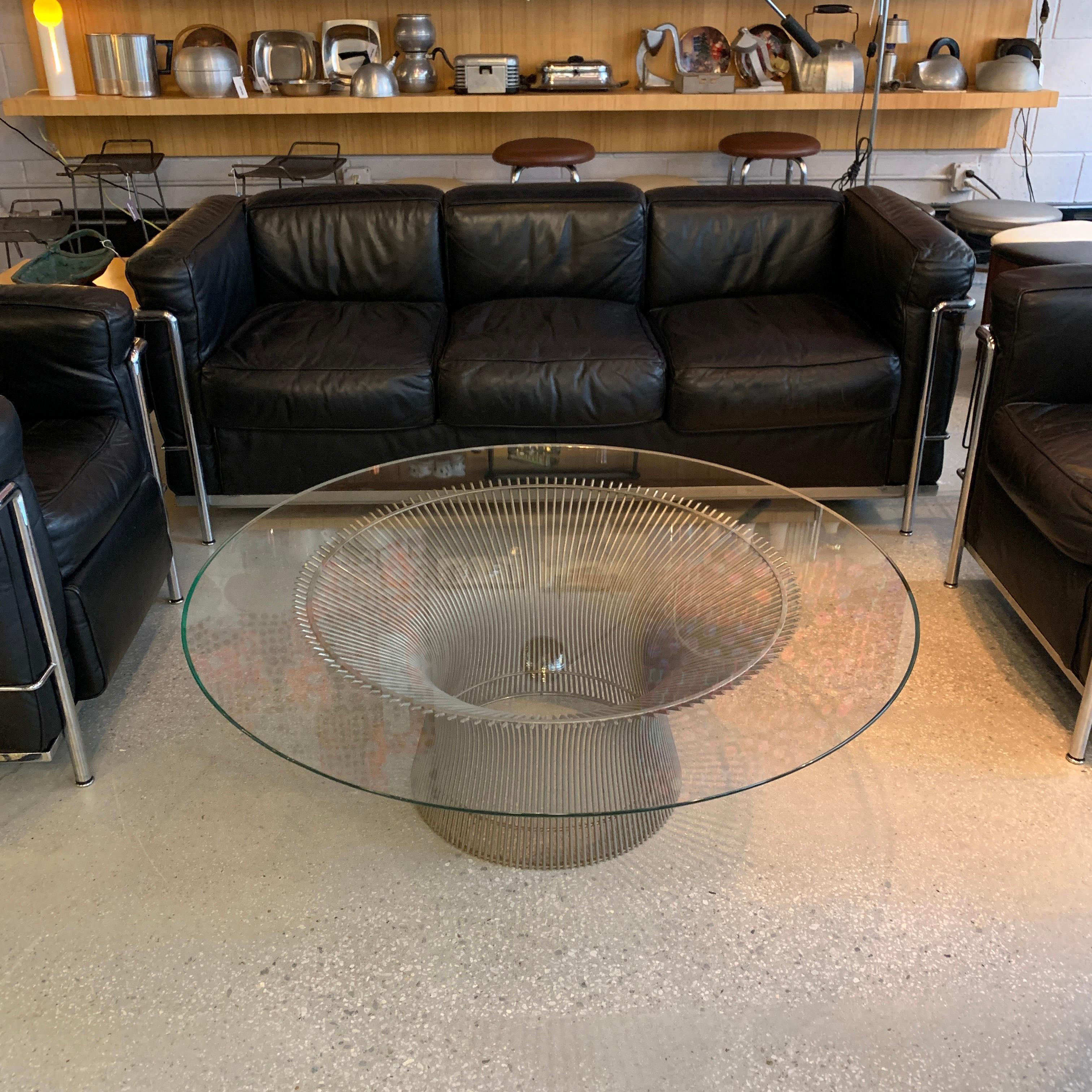 Iconic, Mid-Century Modern, coffee table by Warren Platner for Knoll features a nickel-plated, steel base with 42 inch glass top.