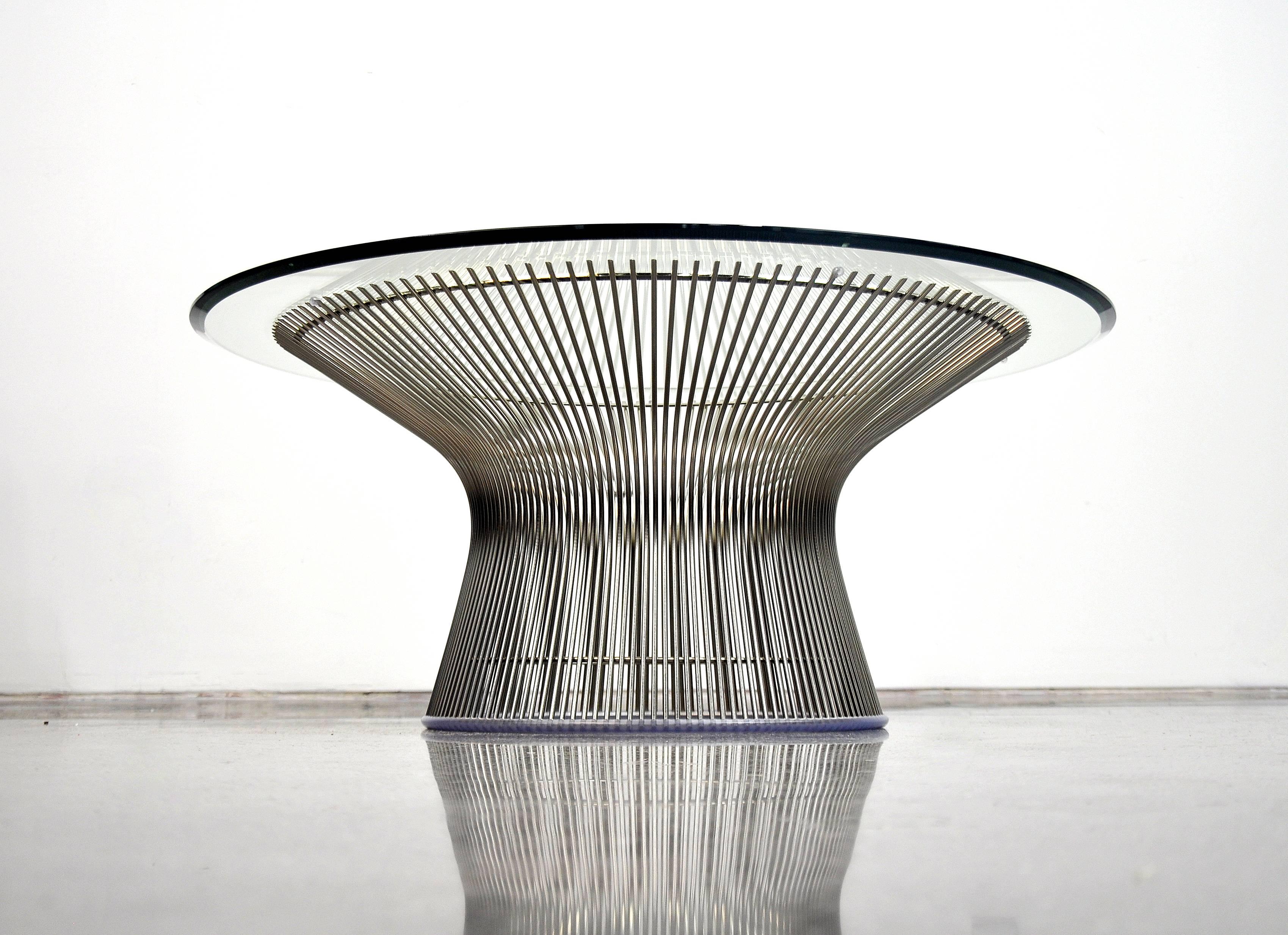 Iconic Mid-Century Modern nickel-plated steel cocktail table. Originally designed in 1966, Warren Platner's collection is timeless. Very decorative yet Minimalist and graceful, the table features curved steel rods welded to circular frames,