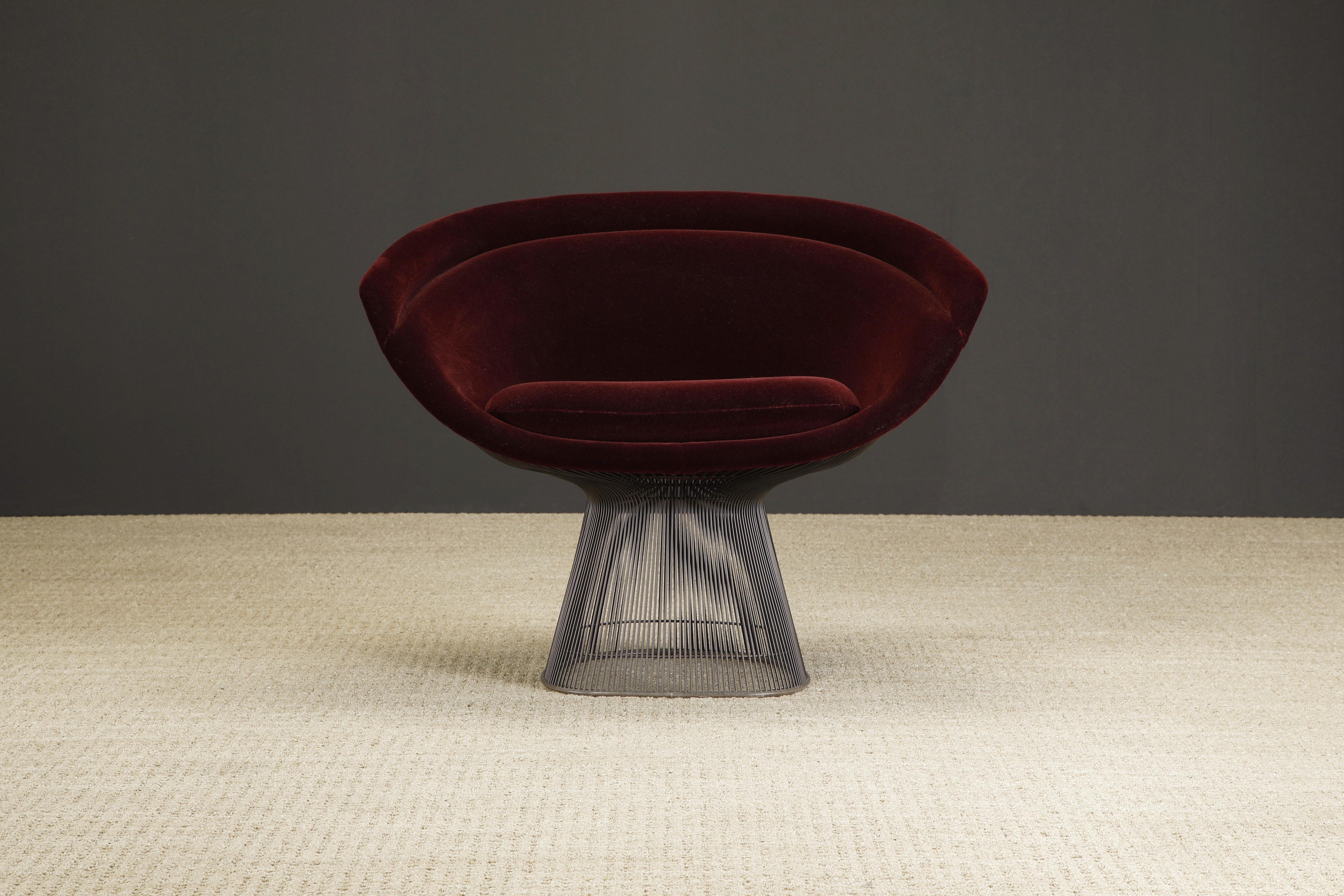 A beautiful Warren Platner for Knoll lounge chair (Model 1715L), upholstered in a gorgeous burgundy (wine) color velvet fabric over a bronze finish frame. 

The deep burgundy velvet is a luxurious upgrade over the standard knit fabric that is more