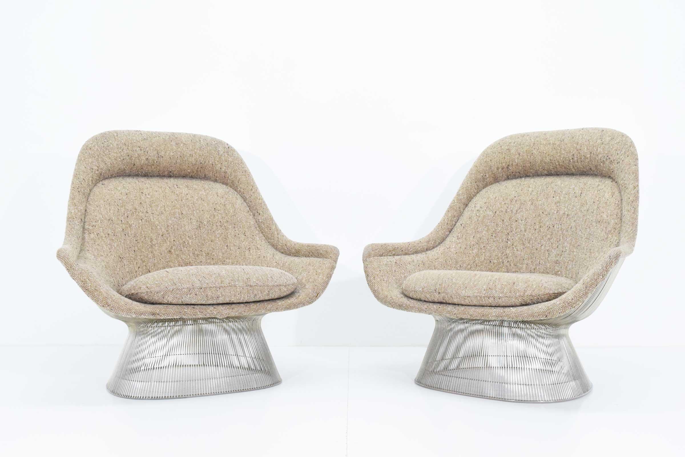 Beautiful pair of large Warren Platner lounge chairs in a beige wool tween that appears to be the original fabric. Chairs are nickel-plated and date 1980s. They are in beautiful condition.