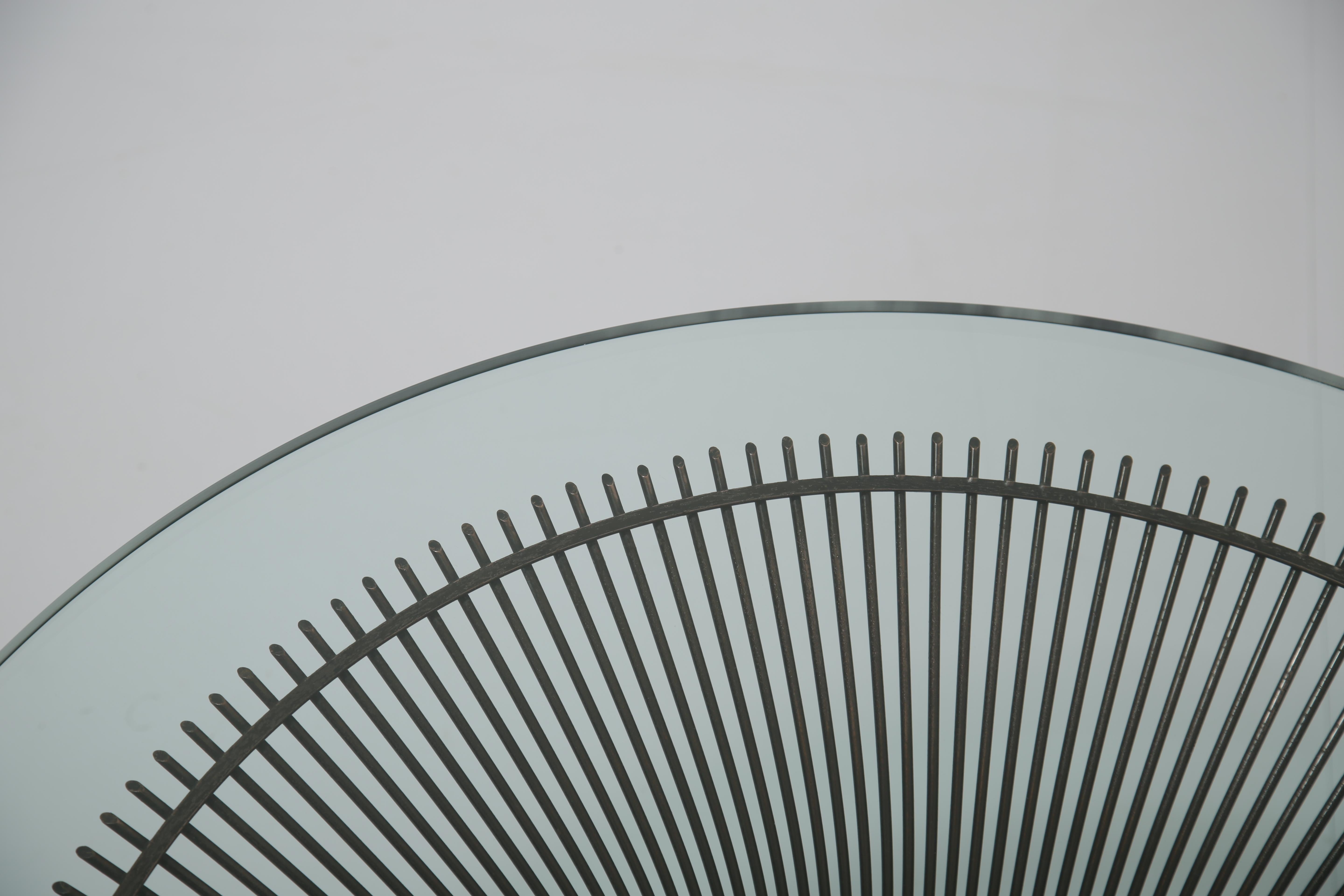 An iconic coffee table designed by Warren Platner for Knoll in 1966, featuring a sculptural patinated bronze metal base paired with a brand-new clear glass top. This table always gets looks and people are always drawn to it. As a design it seems so