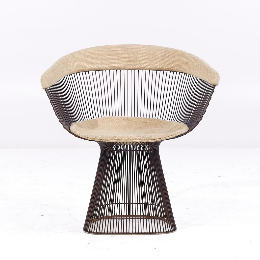 Warren Platner for Knoll Mid Century Bronze Dining Chair

This chair measures: 27.5 wide x 21.5 deep x 29.5 inches high, with a seat height of 15 and arm height/chair clearance of 24.25 inches

All pieces of furniture can be had in what we call