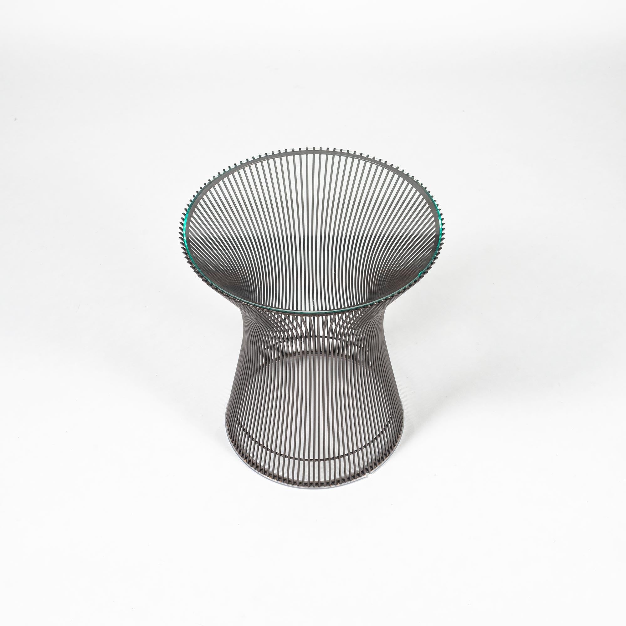 Warren Platner side table for Knoll with beveled glass top and chrome base, circa 1990s. Small chip on glass edge.