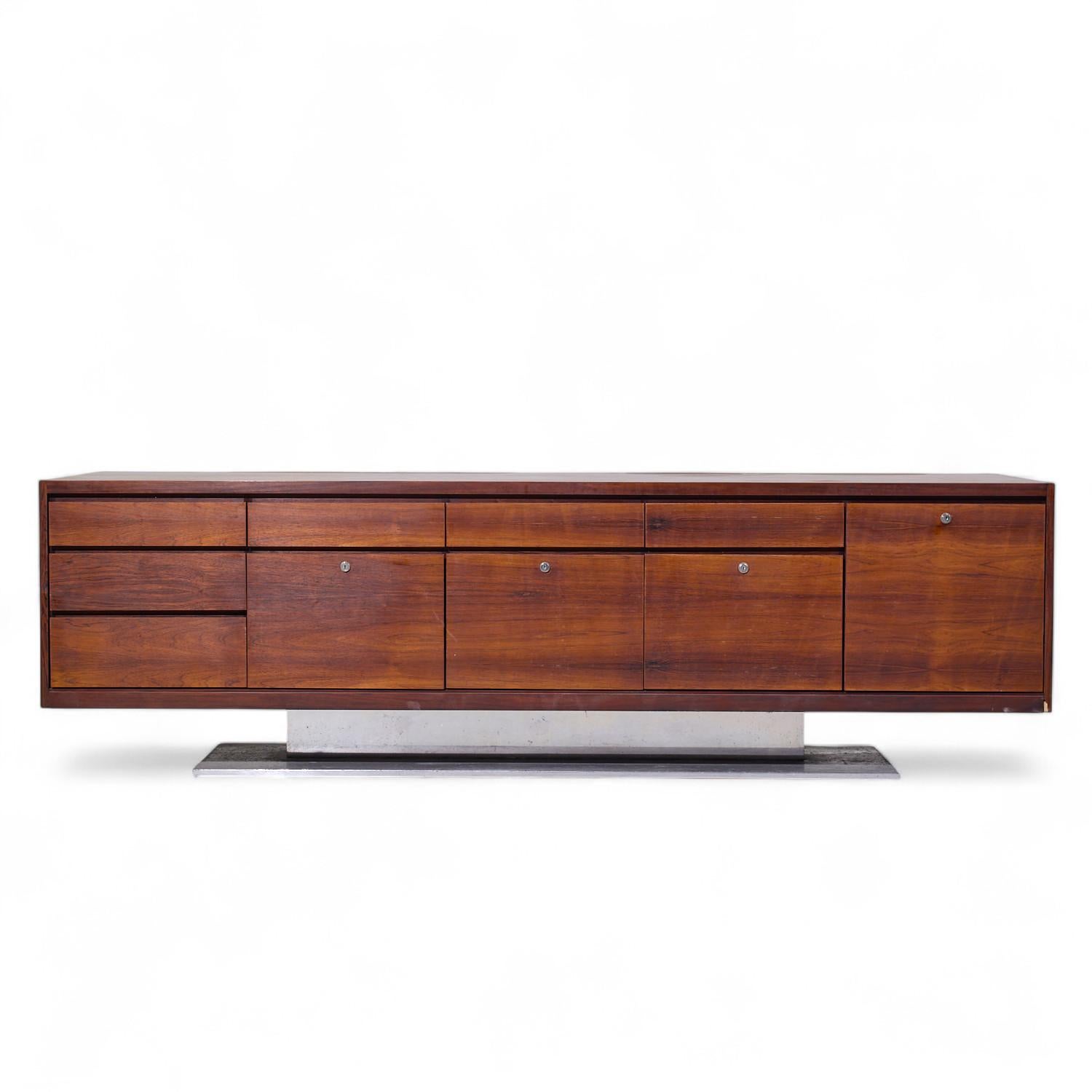 Warren Platner for Lehigh Leopold Mid Century Rosewood and Stainless Steel Credenza

This credenza measures: 91.75 wide x 21.75 deep x 28.25 inches high

All pieces of furniture can be had in what we call restored vintage condition. That means the