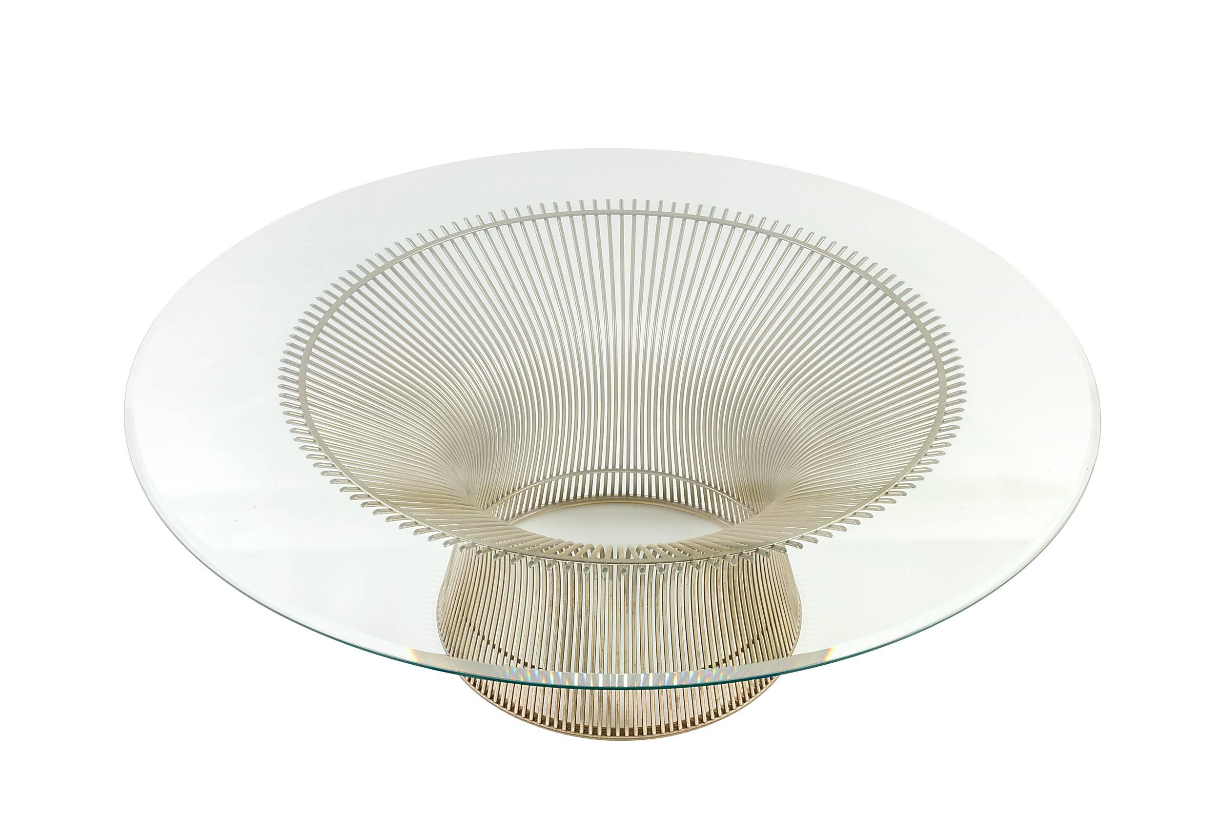 It doesn't get more classic mid century than the Platner collection for Knoll.  It comes with the original beveled edge glass top.
