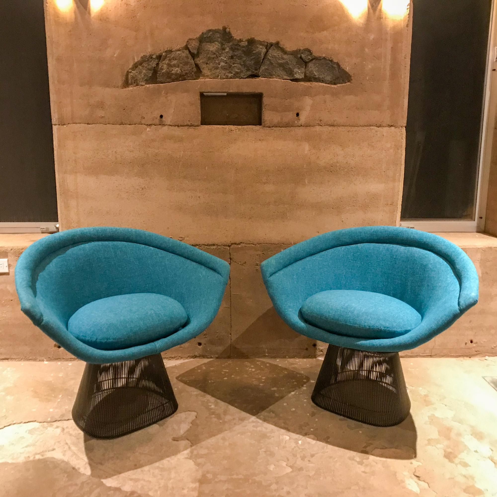 Iconic design by Warren Platner set of lounge chairs (2) for Knoll USA 1960s

No maker stamp is present.

Graceful steel frame with bronze powder coated finish and luscious new teal blue upholstery- exceptional set in a fabulous combination of