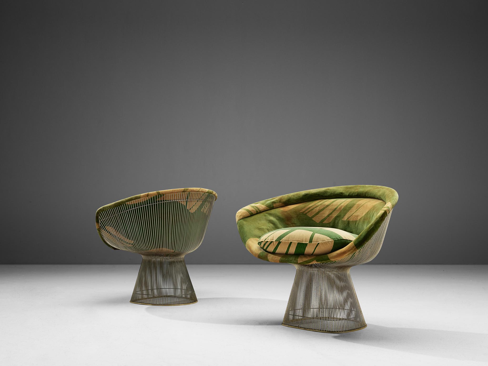 Warren Platner, lounge chairs, metal and yellow-green fabric, United States, 1966. 

This iconic pair by Warren Platner (1919-2006) is created by welding curved steel rods to circular and semi-circular frames, simultaneously serving as structure