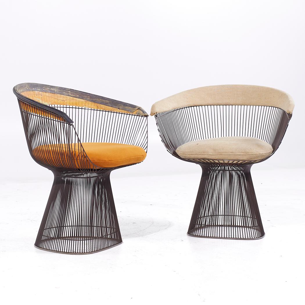 Warren Platner Mid Century Dining Chairs - Pair

Each chair measures: 27.5 wide x 21.5 deep x 29.5 high, with a seat height of 17.5 and arm height/chair clearance 24.25 inches

PLEASE NOTE: Each chair is missing a spoke. These chairs are sold AS IS.