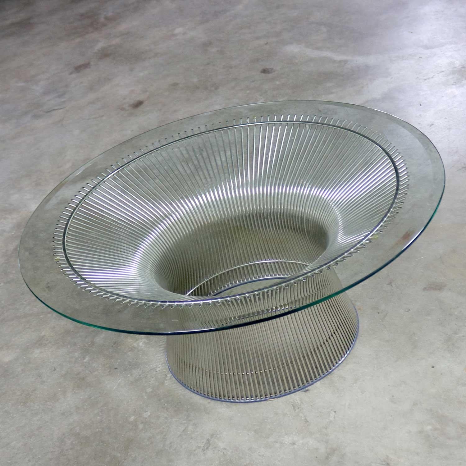 Handsome and iconic nickel steel rod coffee table with 35.5-inch round beveled glass top designed by Warren Platner for Knoll. It is in fabulous vintage condition. The glass may have some small signs of use but nothing outstanding. Please see