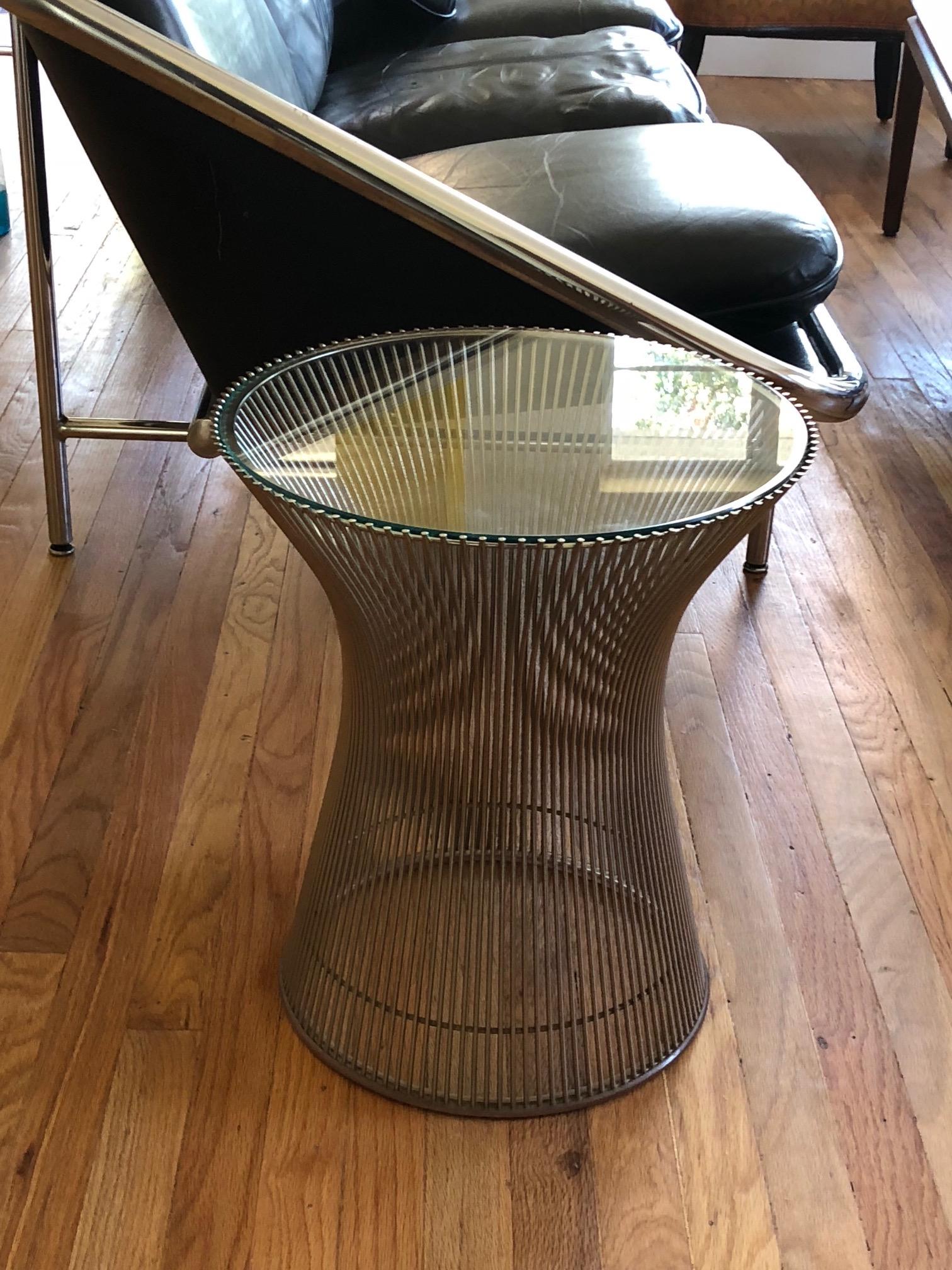A classic Warren Platner for Knoll side table with glass top and chromed base.