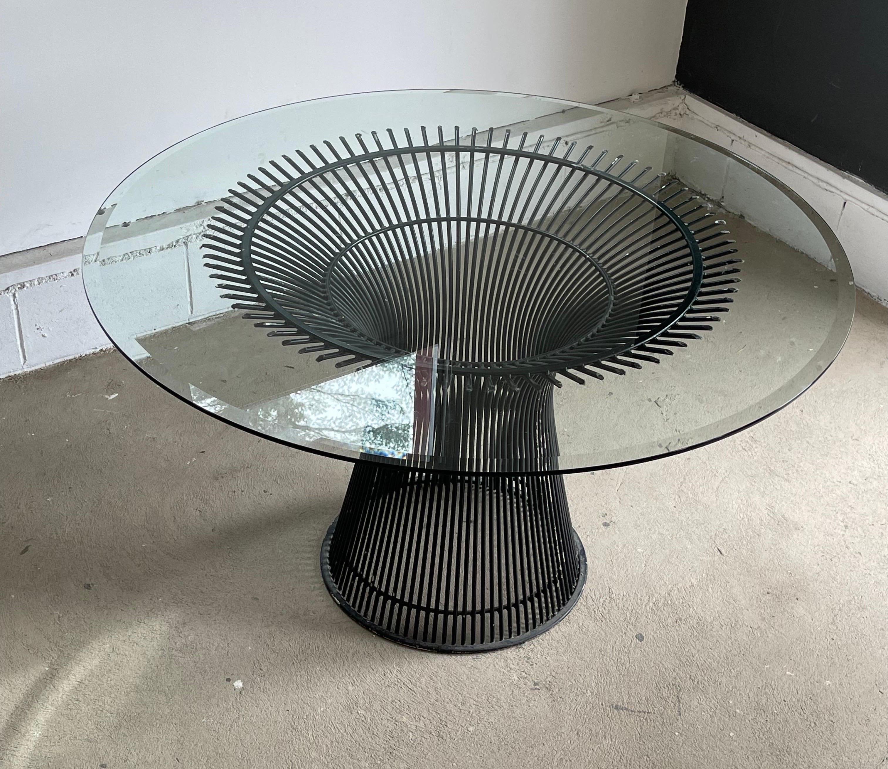 Beautiful Mid-Century Modern glass top on Steel base dining table by Warren Platner for Knoll, circa 1980s. Features a 53” thick glass top and base made of curved rods. This modern dining table can seat up to six and is in good vintage condition