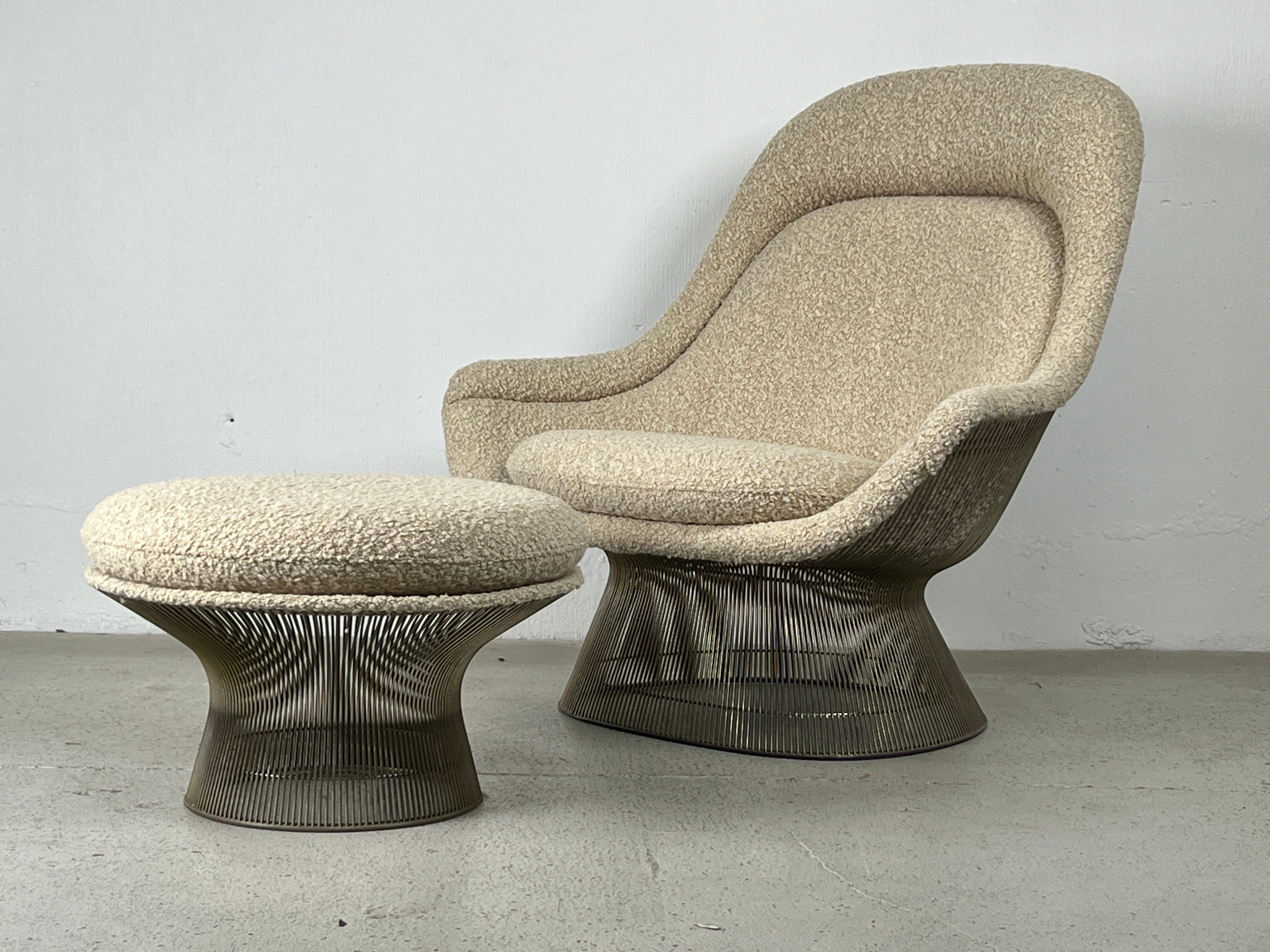 A nickel plated throne chair and ottoman designed by Warren Platner for Knoll. Reupholstered in Holly Hunt / Breathe Easy / Latte. 