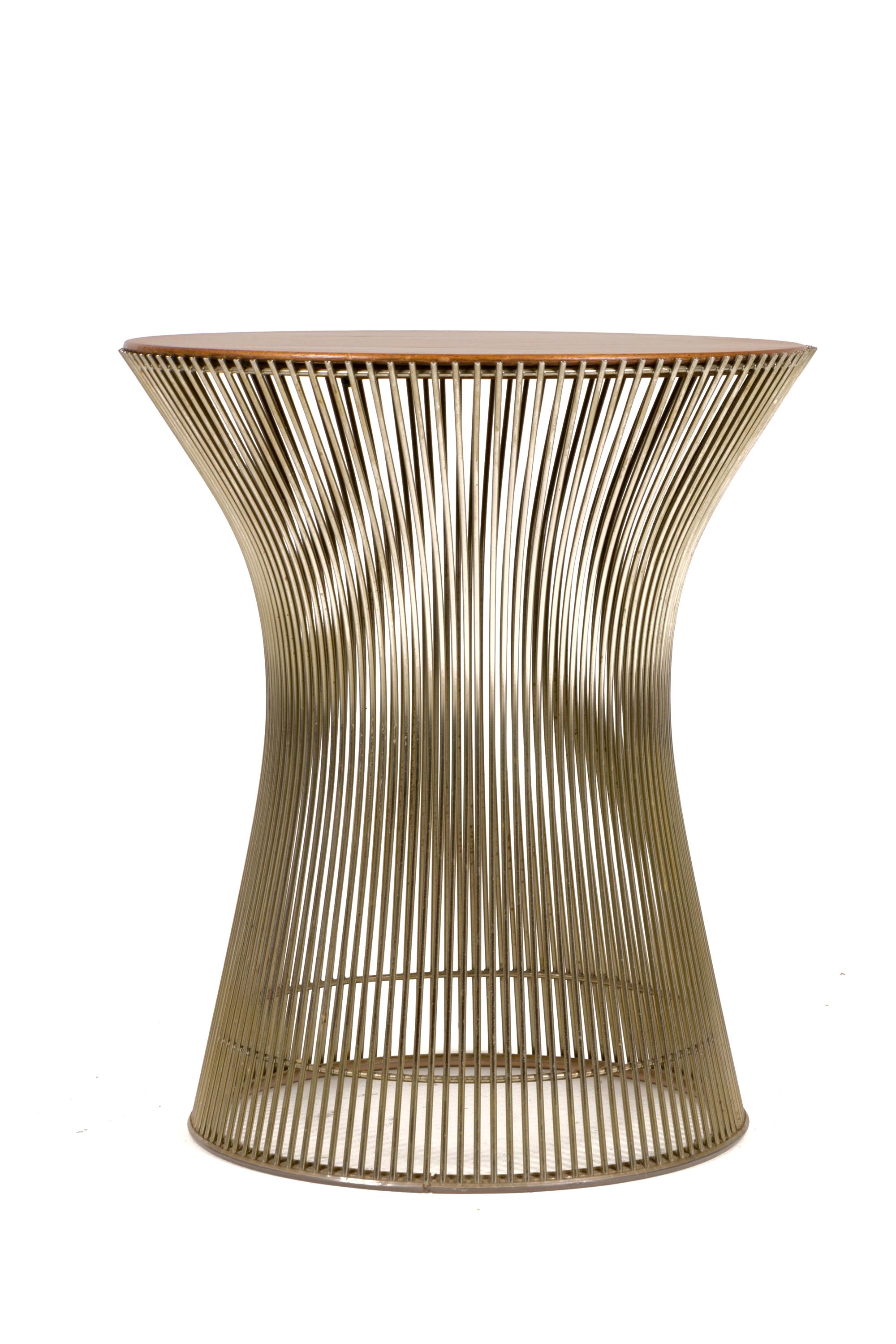 Part of the Platner collection by Knoll in 1962 the side table well demonstrates Platner's Industrial materials married with the graceful organic design. The table is constructed in walnut top and chrome base.
