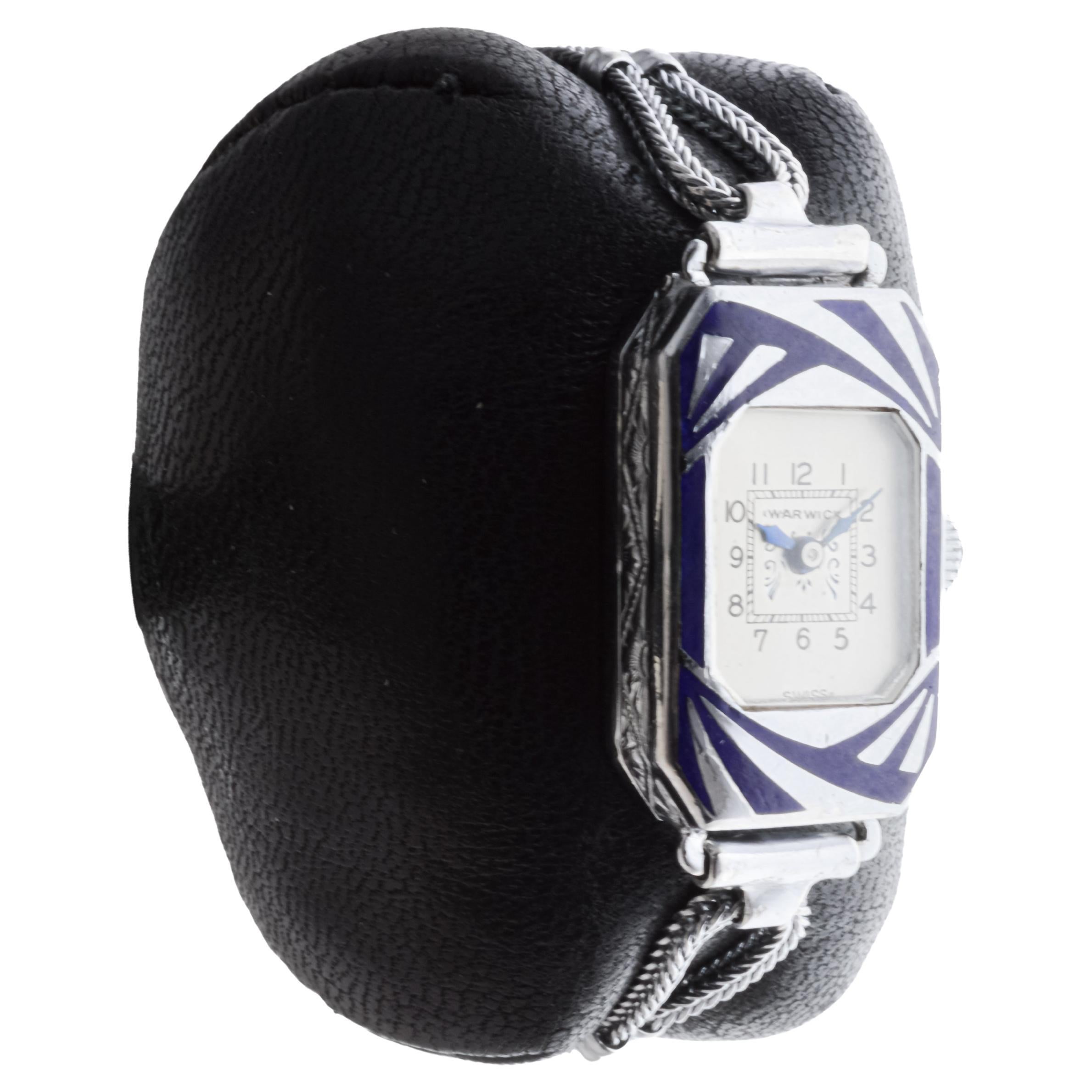 FACTORY / HOUSE: Warwick Watch Company
STYLE / REFERENCE: Art Deco Tank Style 
METAL / MATERIAL: Chrome and Enamel 
CIRCA / YEAR: 1930's
DIMENSIONS / SIZE: Length 30mm X Width 17mm
MOVEMENT / CALIBER: Manual Winding / 6 Jewels 
DIAL / HANDS: Factory