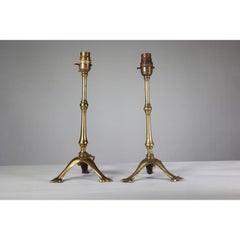 WAS Benson. A pair of Arts & Crafts brass table lamps with a serpent style tails