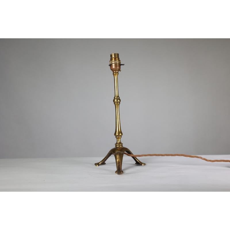Early 20th Century WAS Benson. A pair of Arts & Crafts brass table lamps with a serpent style tails For Sale