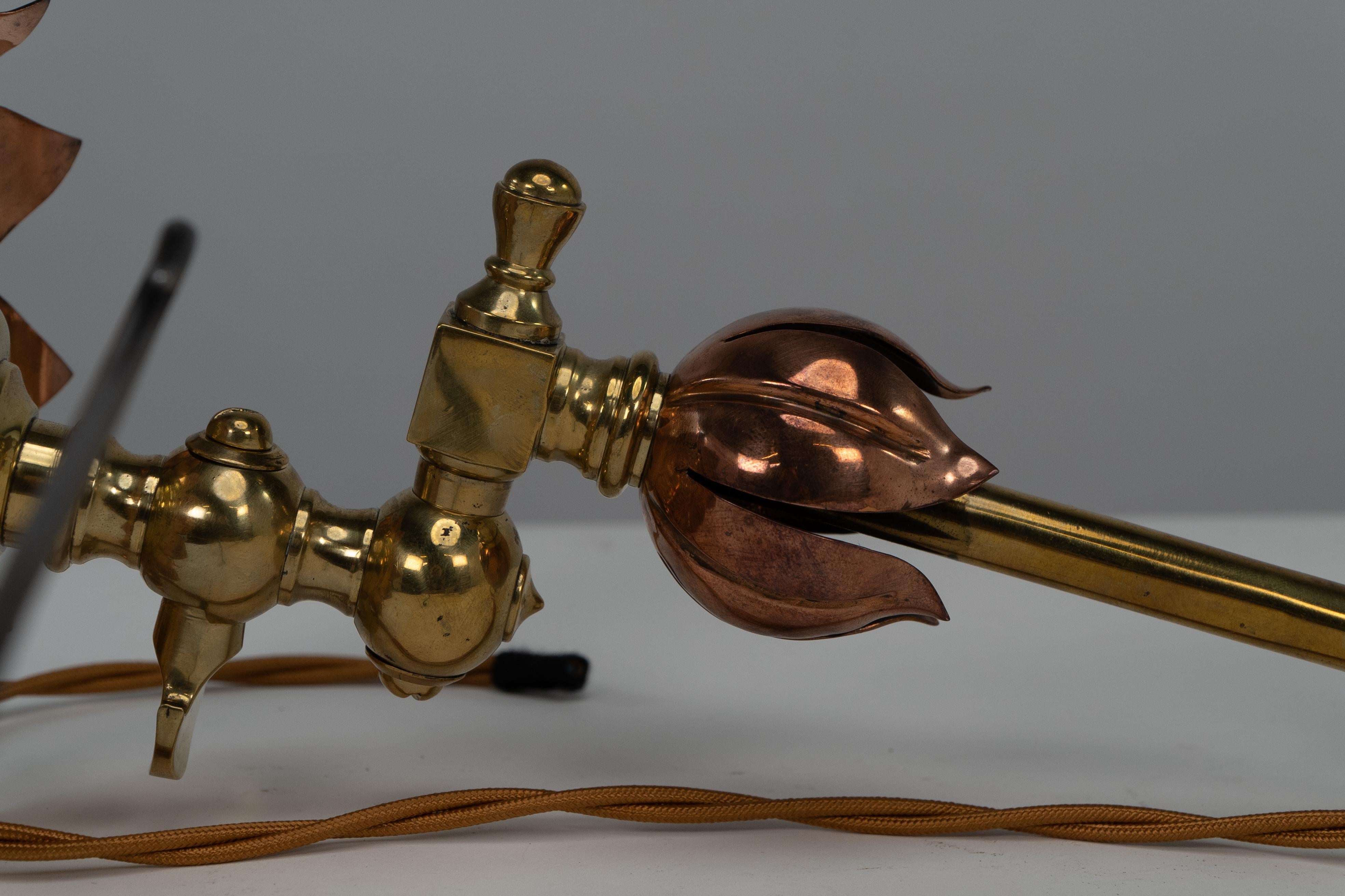 Early 20th Century WAS Benson. A pair of copper & brass wall lights with lily pad wall back plates. For Sale