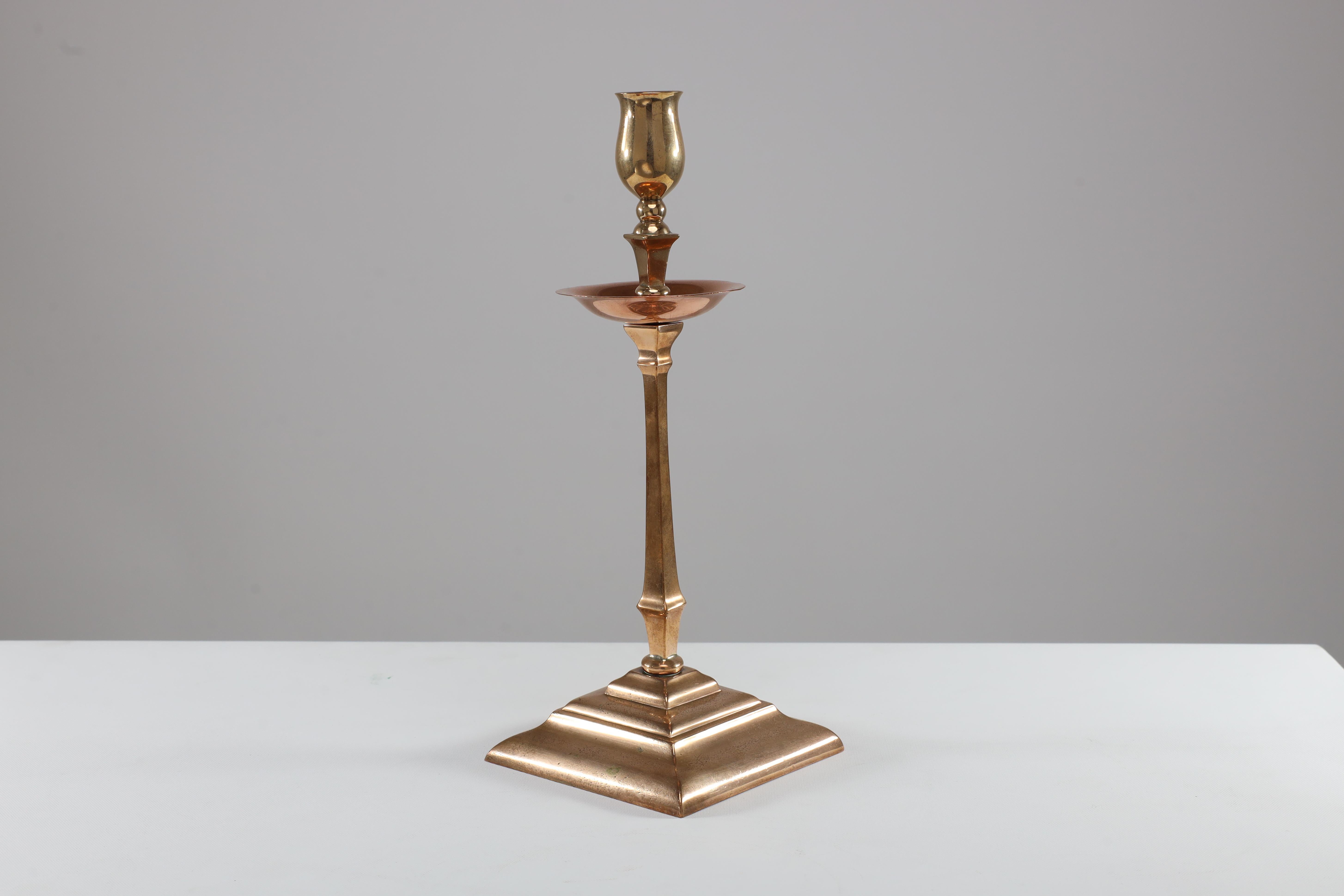 Early 20th Century WAS Benson. A pair of Arts and Crafts brass and copper candlesticks For Sale