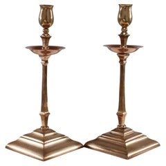 Antique WAS Benson. A pair of Arts and Crafts brass and copper candlesticks