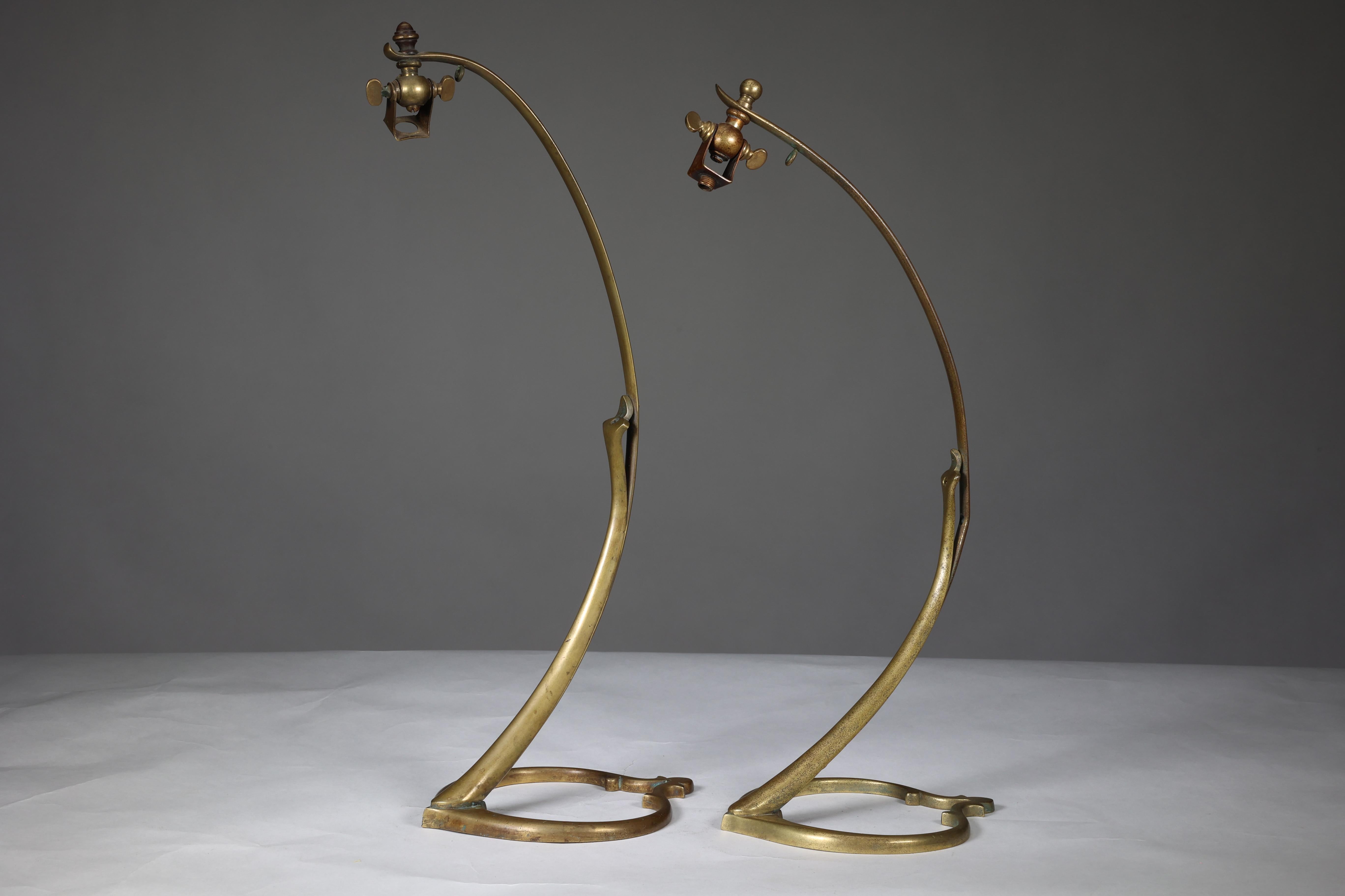 English WAS Benson. A near pair of Arts and Crafts brass swan style table lamps.