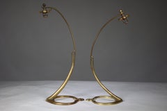 WAS Benson. A near pair of Arts and Crafts brass swan style table lamps.