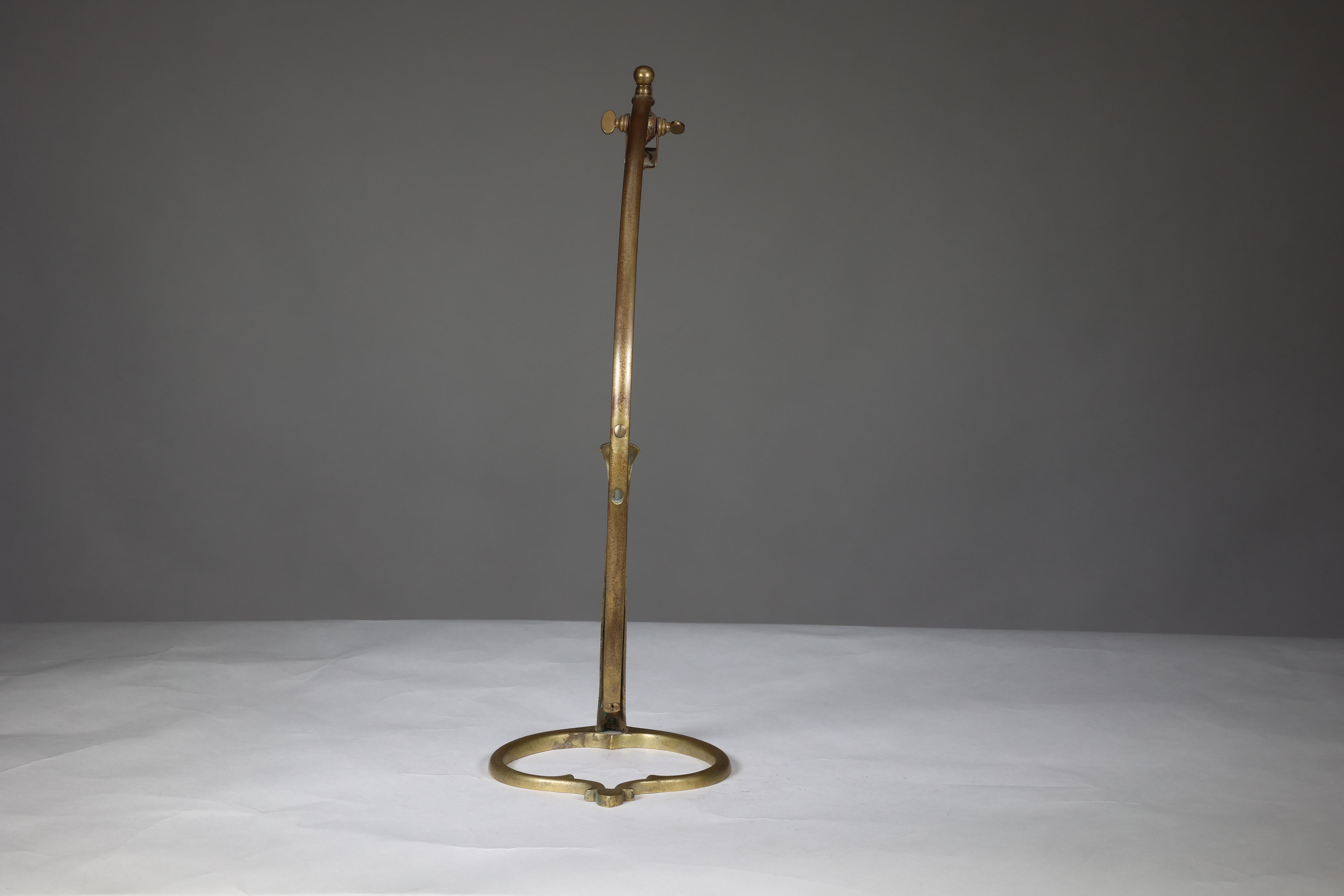 Early 20th Century WAS Benson. A near pair of Arts and Crafts brass swan style table lamps.