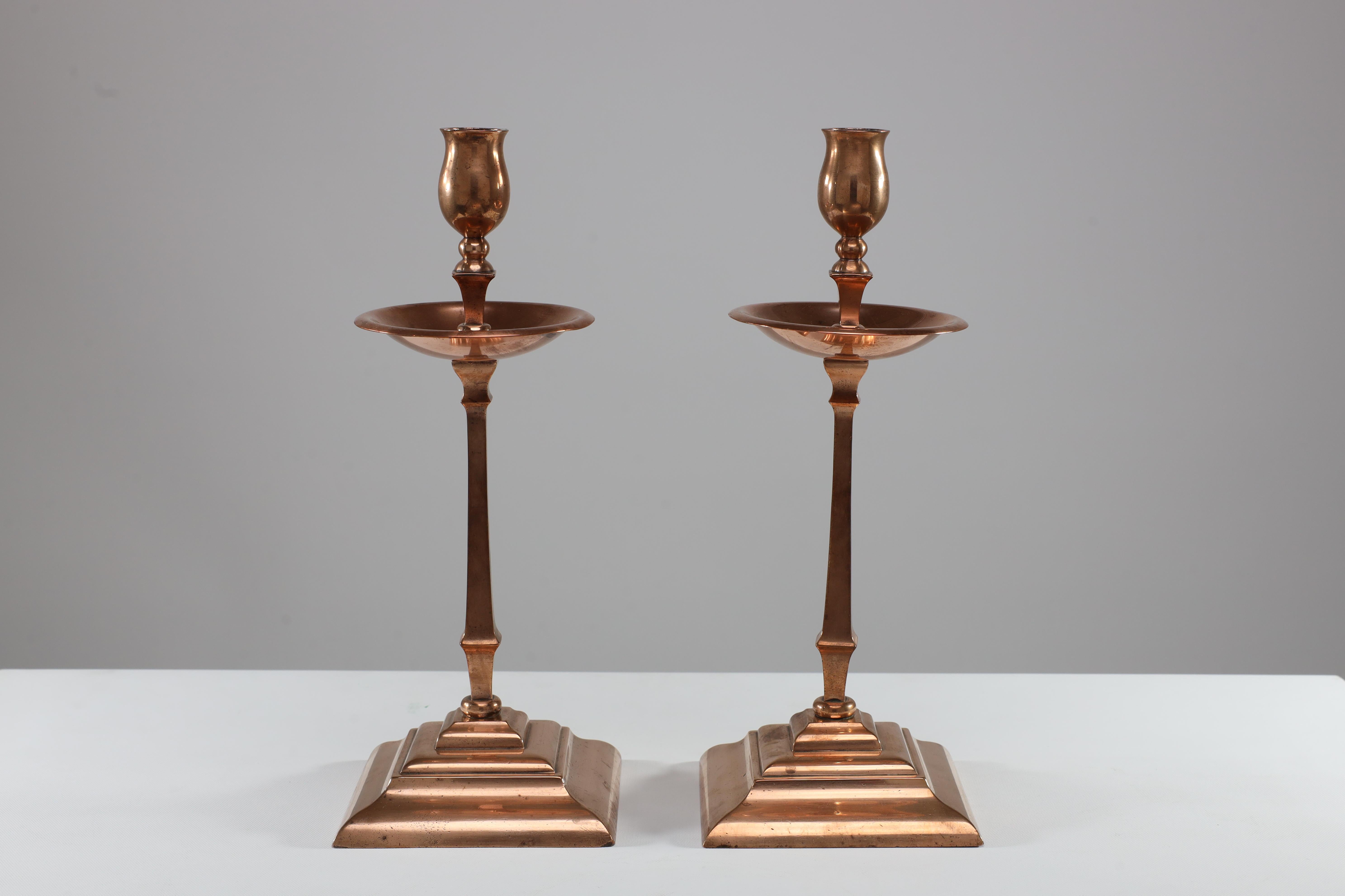 English WAS Benson. A pair of Arts and Crafts copper and brass candlesticks. For Sale