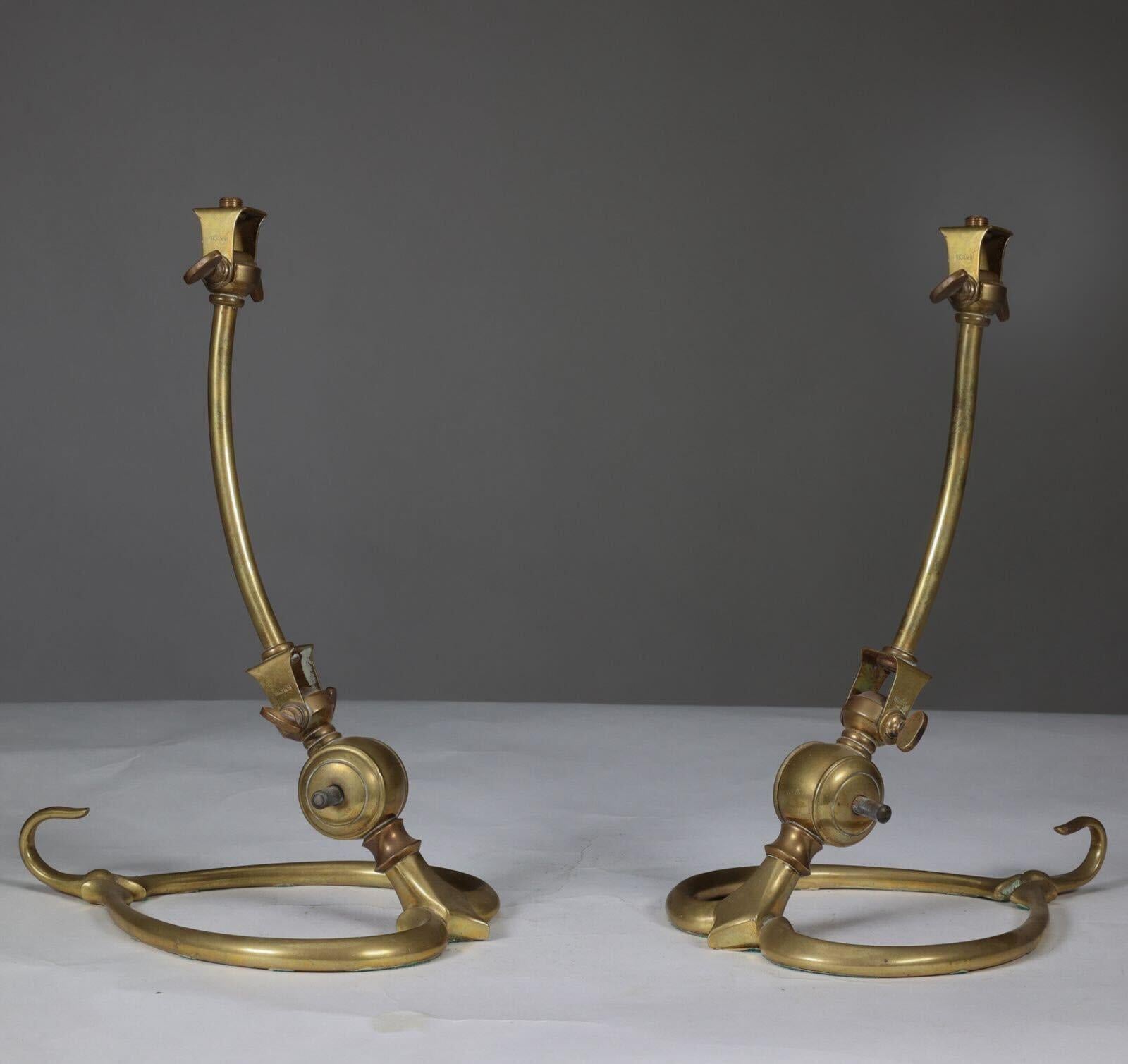WAS Benson. A pair of Arts & Crafts brass table lamps with heart shaped bases & original switches. WAS Benson Catalogue plate 15, illustration No 1139. Photographed here as the standard option but can also be used as bracket as seen on the catalog.