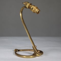 WAS Benson. An Arts and Crafts brass table lamp with heart shaped base