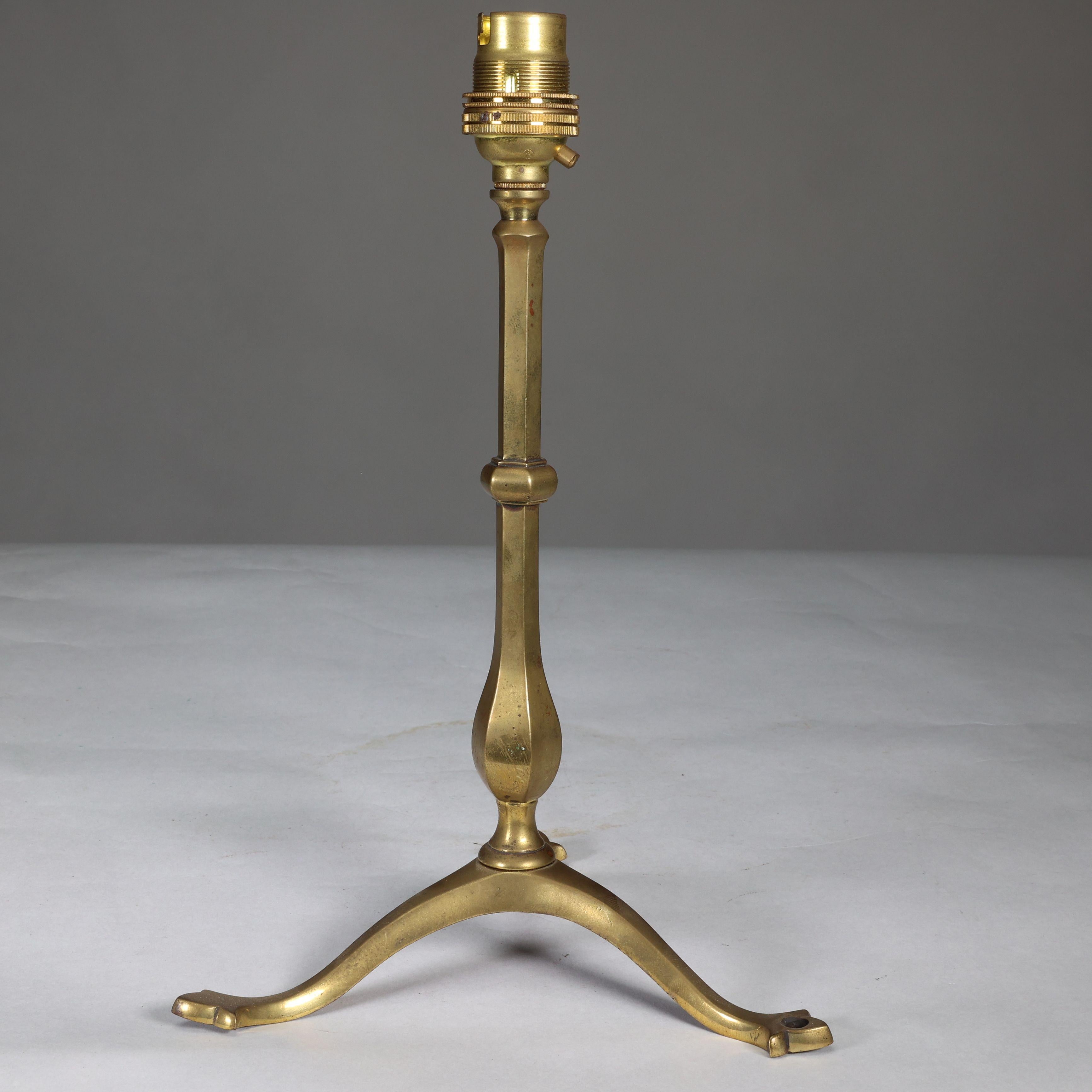 WAS Benson. An Arts and Crafts brass three leg table lamp.