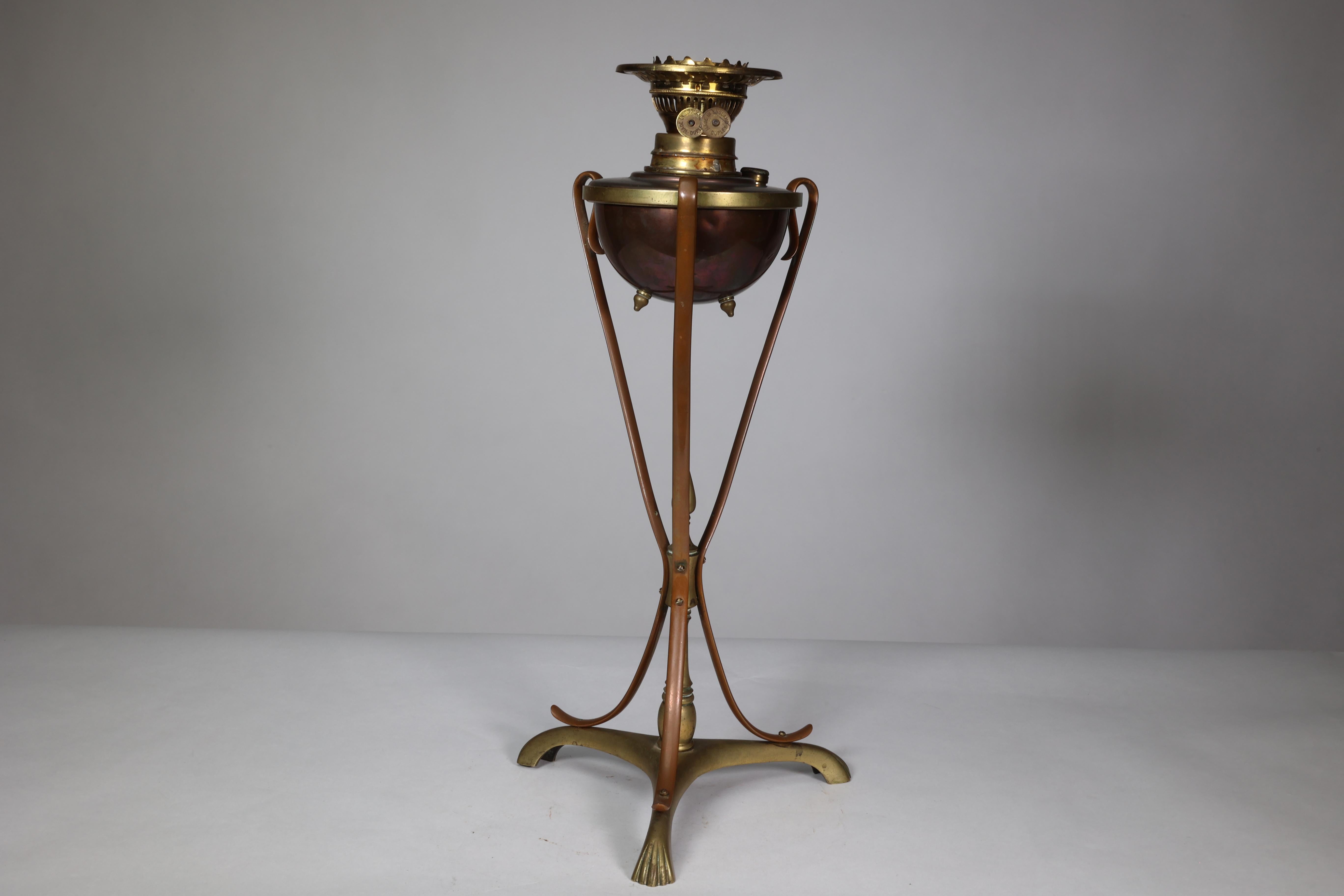 W A S Benson. An Arts and Crafts copper and brass oil lamp. WAS Benson Catalogue number 95.