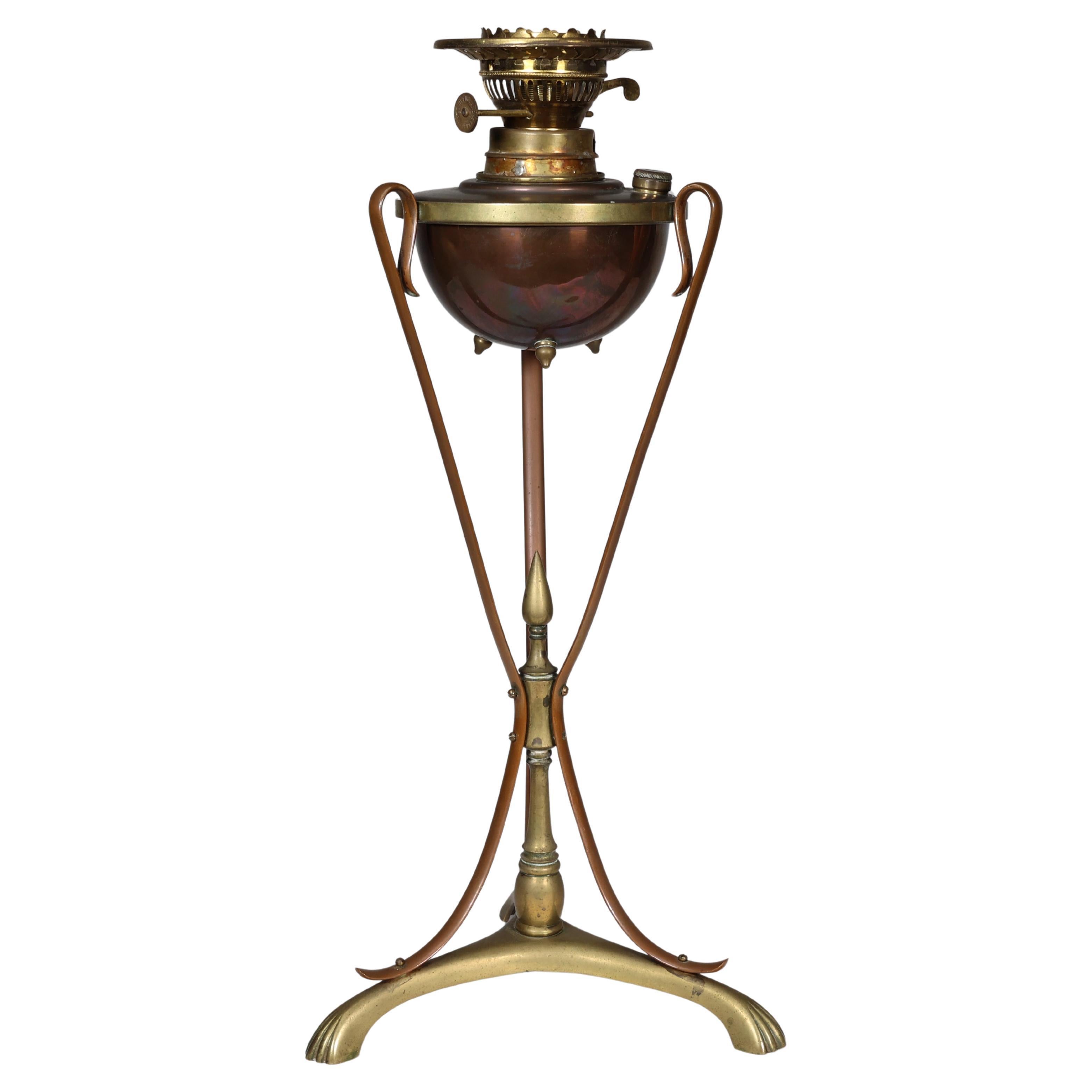 WAS Benson. An Arts and Crafts copper and brass oil lamp. For Sale