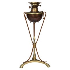 Used WAS Benson. An Arts and Crafts copper and brass oil lamp.