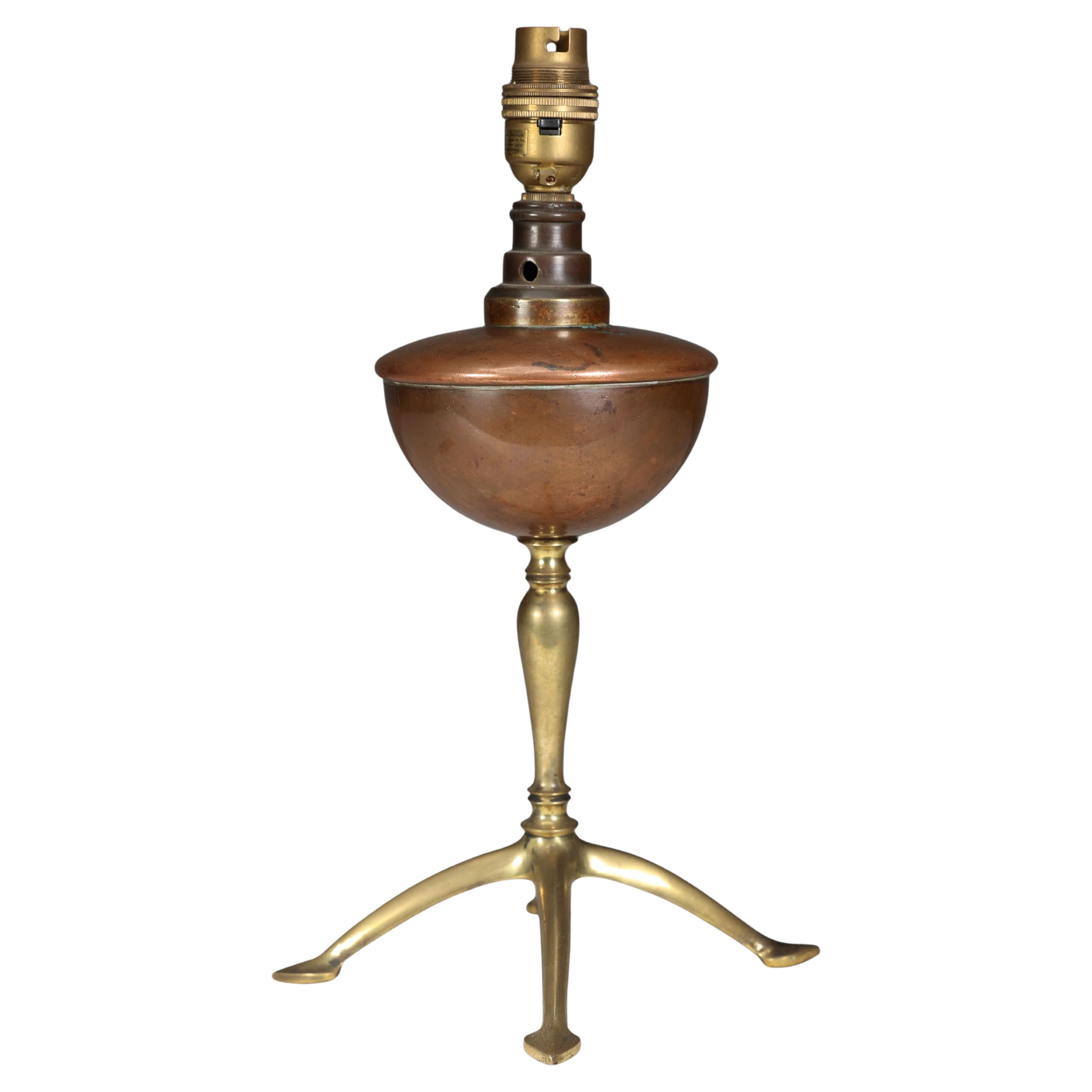 WAS Benson. An Arts and Crafts four leg table oil lamp converted to electricity