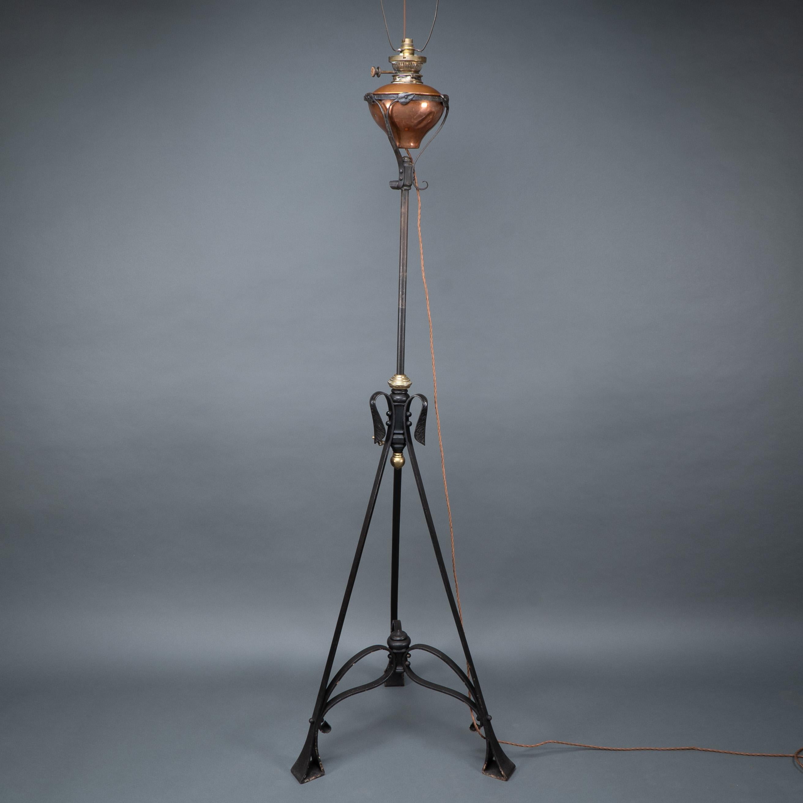 WAS Benson. An extremely rare telescopic iron standard or floor lamp. With later rewiring for electricity.Extended Height: 182.5 cm
