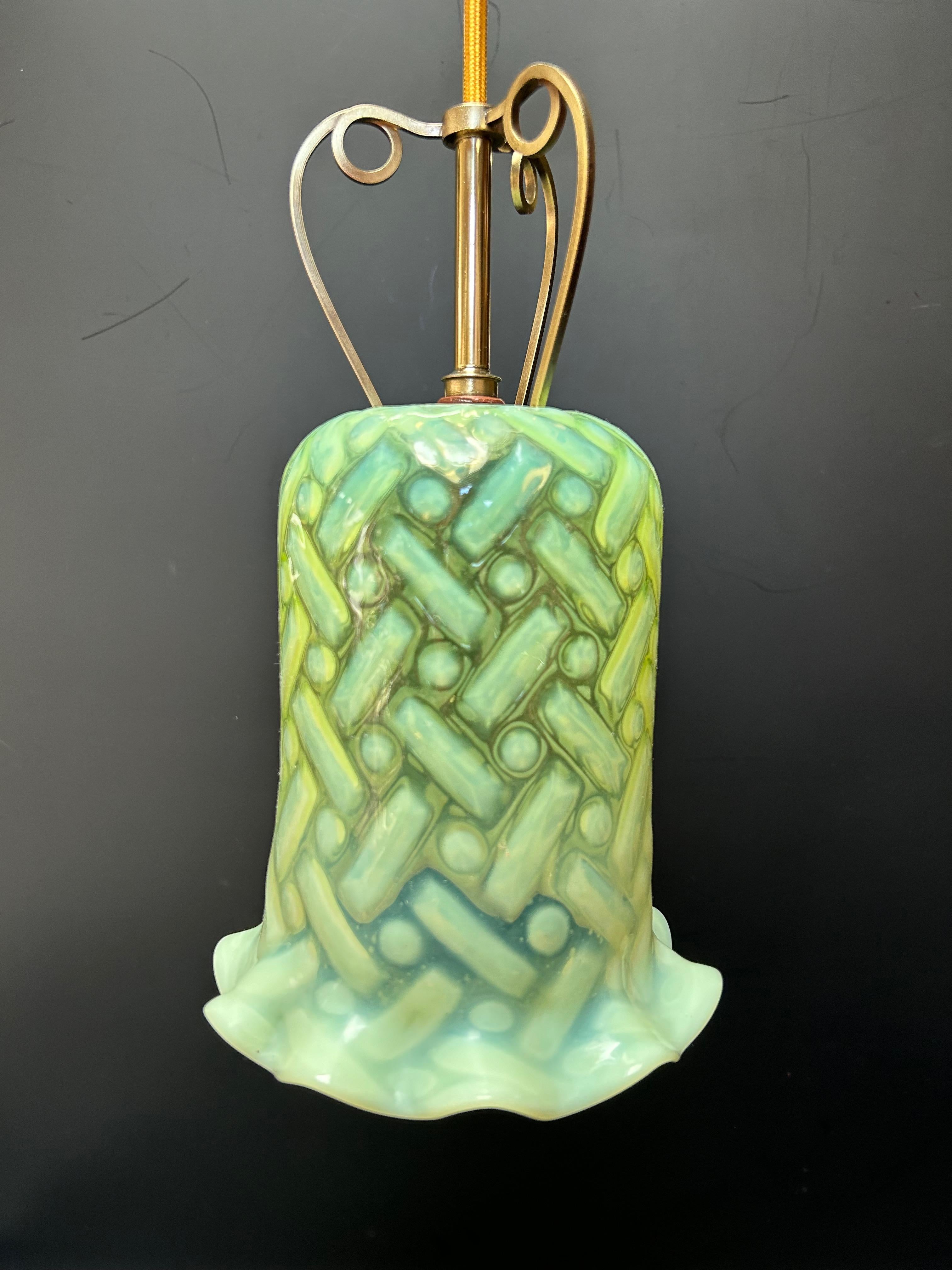 Art Nouveau pendant light in brass and copper by WAS Benson with an opalescent uraline tulip by James Powell.
In perfect condition, electrified.
Height: 60cm adjustable 
Tulip height: 18.5 cm 
Tulip diameter: 16 cm 

W.A.S. Benson was an English
