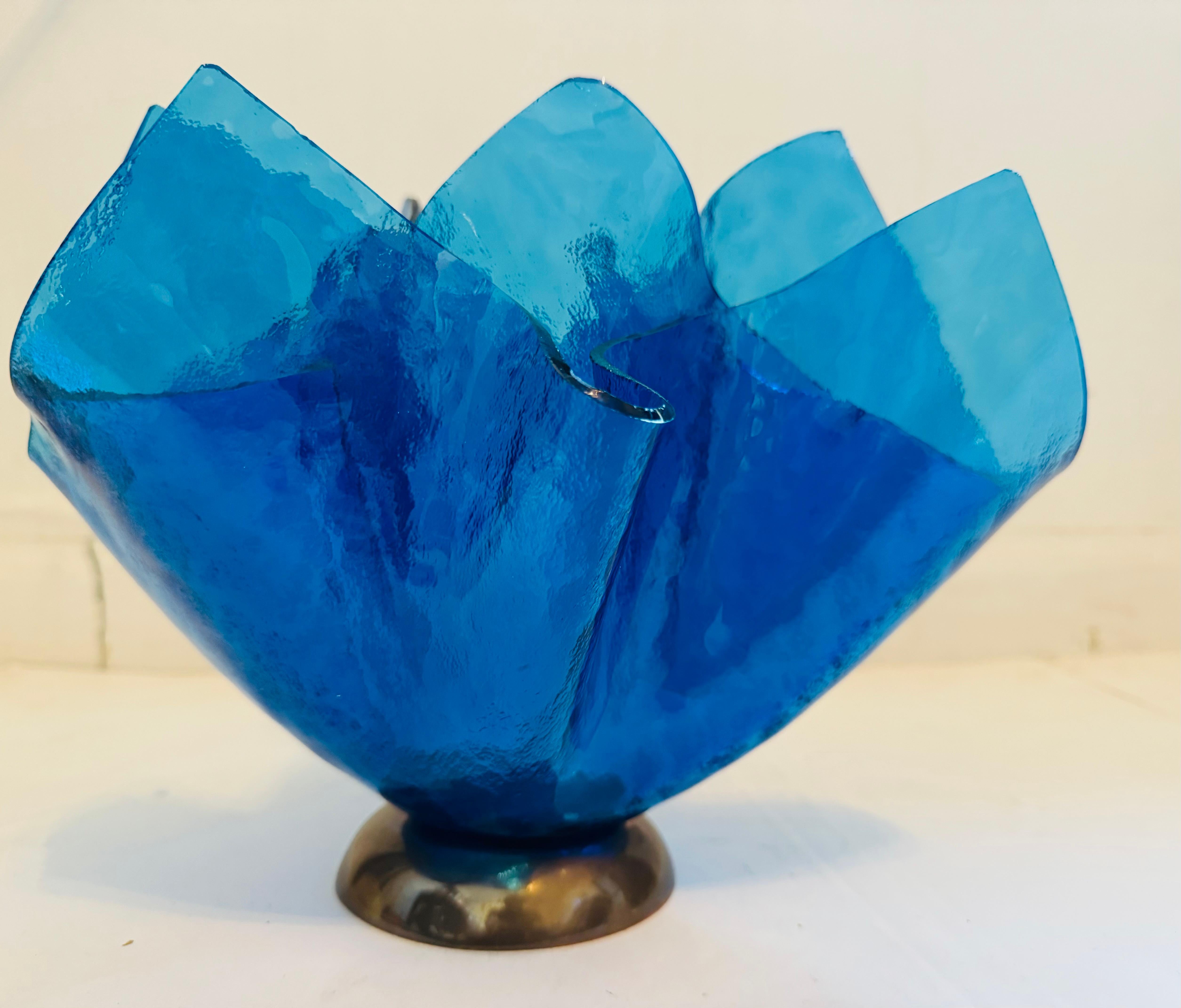 A beautiful 1980s Post Modern blue glass sculptural vase on a bronze vase made by famed Italian designer, Esa Fedrigolli. Rare. Signed.